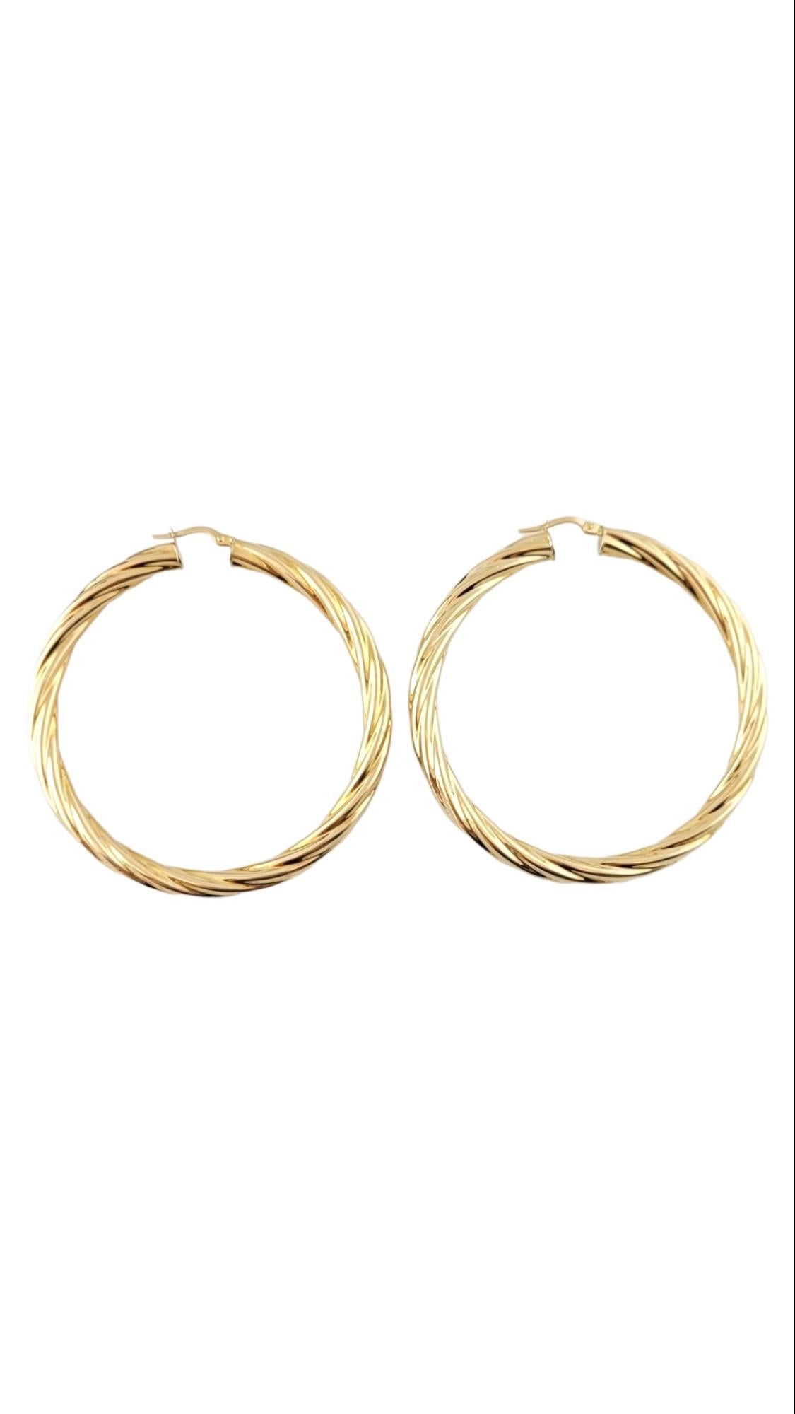 14K Yellow Gold Large Twisted Hoop Earrings

This gorgeous set of 14K gold hoop earrings have a beautiful, twisted design!

Size: 60.8mm X 59.2mm X 5.0mm

Weight: 9.47 g / 6.1 dwt

Hallmark: UNOAERRE 585

Very good condition, professionally