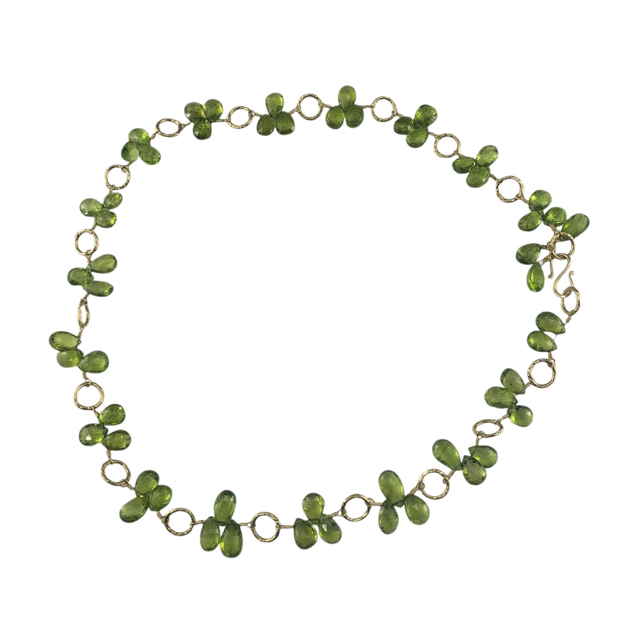 14 Karat Yellow Gold Peridot Briolette Beaded Choker Necklace JAGi Certified-

This lovely necklace features 56 briolette cut yellowish green peridot stones (8.5 mm x 6.3 mm) set in 14K yellow gold.

Approximate total peridot weight: 90.16

*Stone