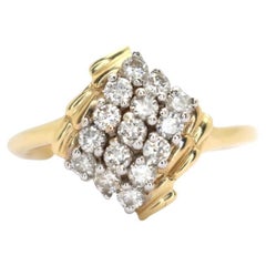 14k yellow ladies diamond cluster ring with .50pts. in diamonds