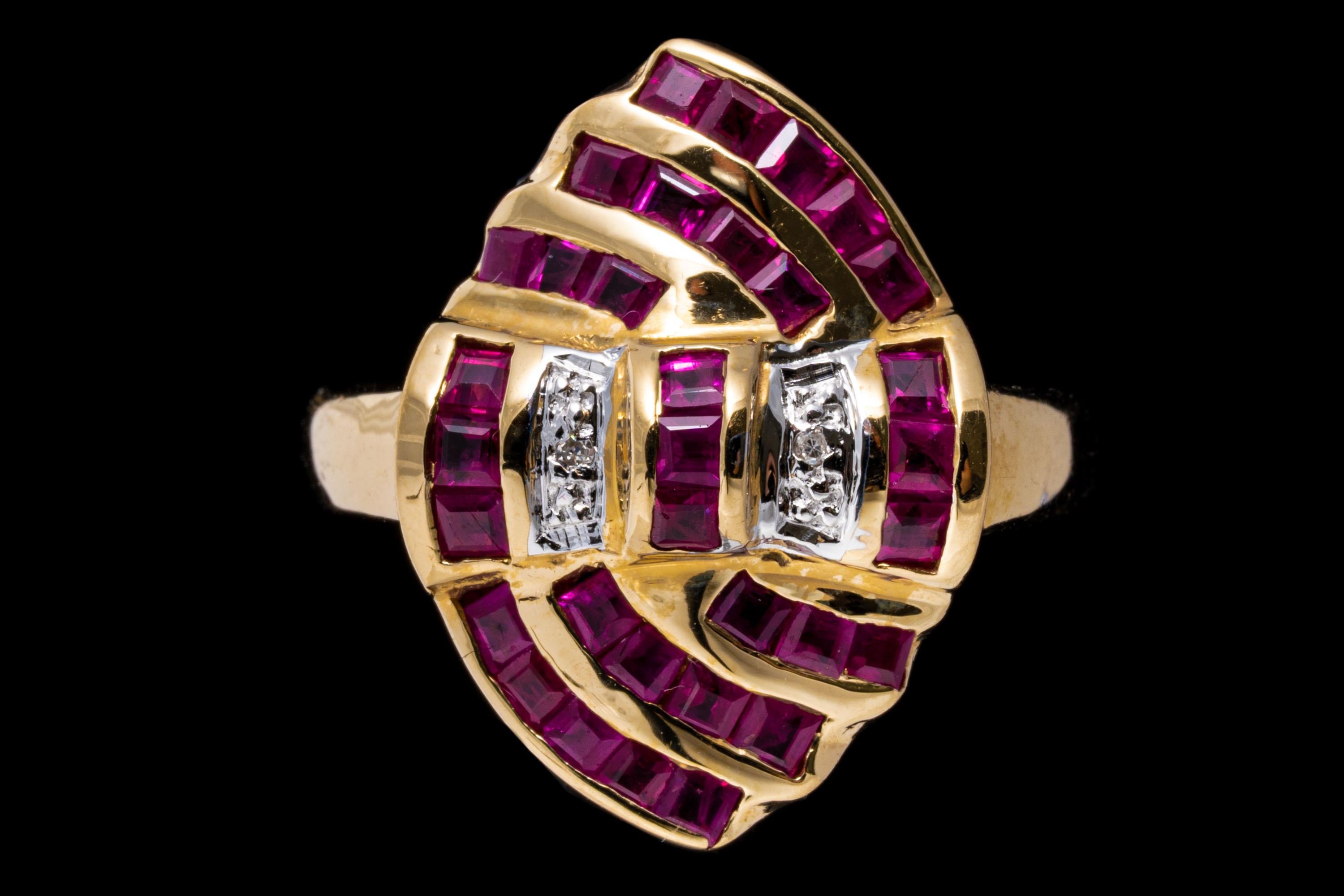 14k yellow gold ring. This unique navette shaped ring, decorated with channel set swirls of square faceted, medium to light reddish pink color rubies, approximately 1.14 TCW, highlighted with two accent diamonds.
Marks: 14k 
Dimensions: 1/2