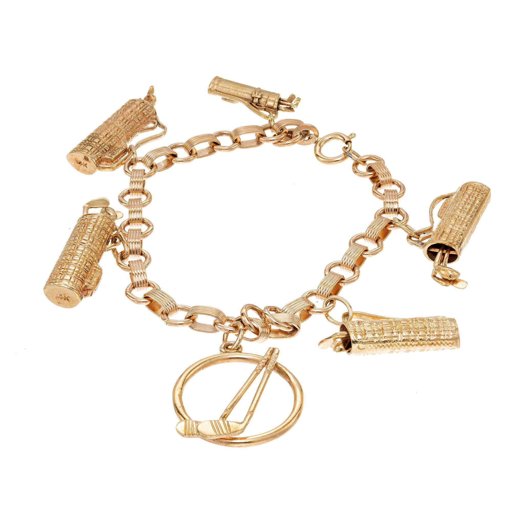 Gold theme charm bracelet with six solid 14k yellow gold golf charms on a rose gold link bracelet. Four of the charms have movable golf clubs. 7 inches in length

14k yellow gold 
14k rose gold
26.9 grams
Bracelet: 7 Inches 
Width: