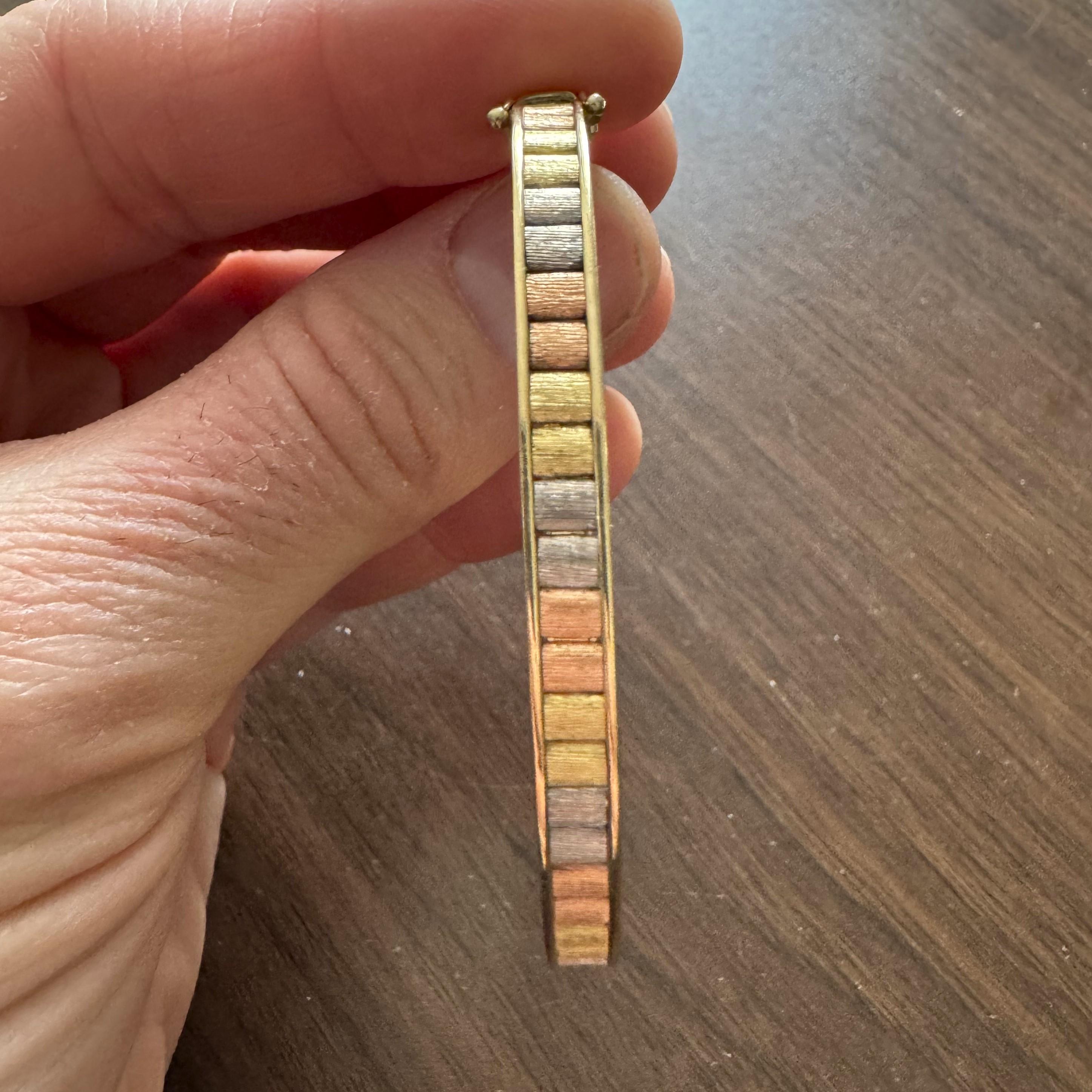 Condition:  Excellent Condition, Professionally Cleaned and Polished
Metal:  14k Gold (Marked, and Professionally Tested)
Weight:  14.4g
Length:  6.75 Inches Inner Circumference
Width:  5mm
Closure:  Box Tab Insert with Safety