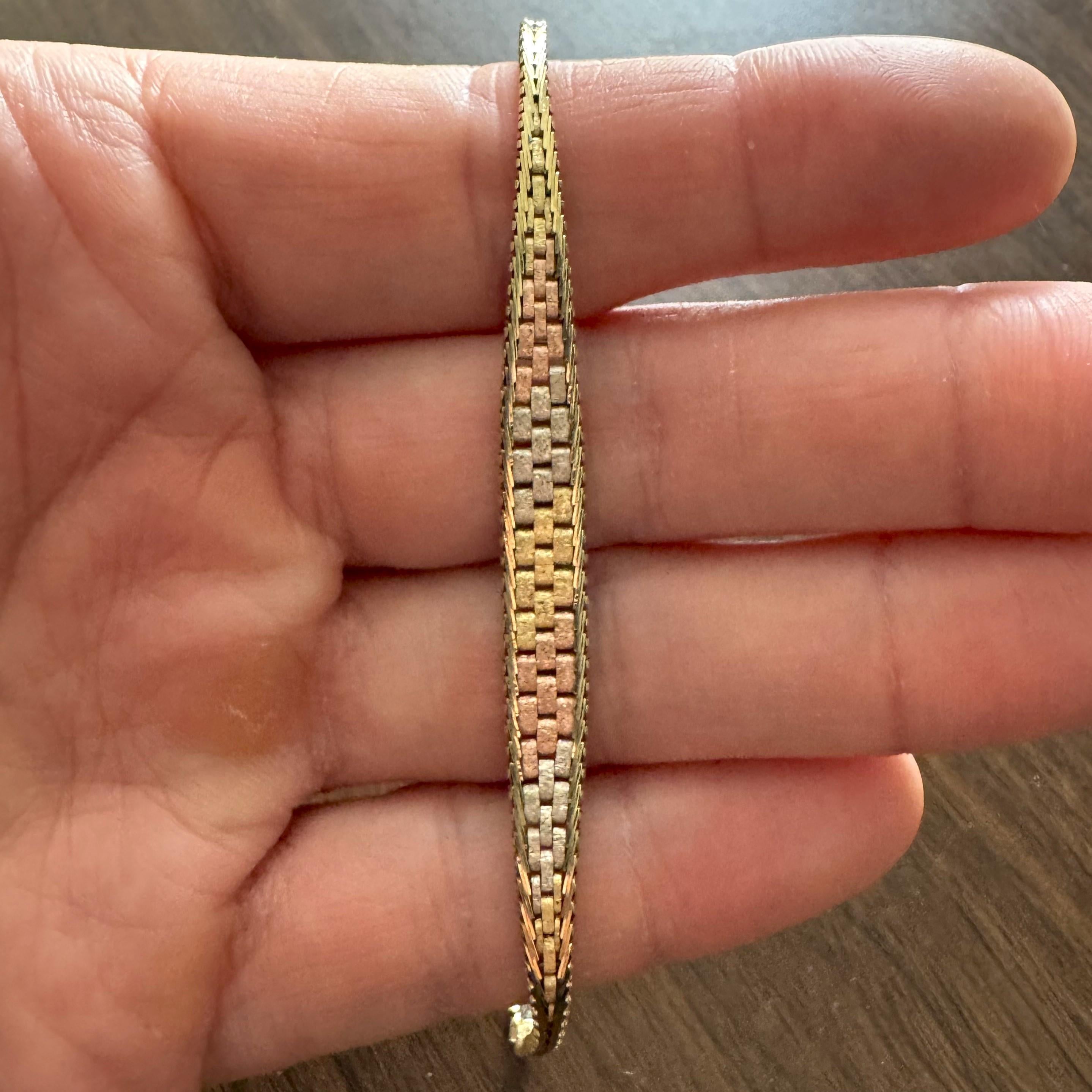 Condition:  Excellent Condition, Professionally Cleaned and Polished
Metal:  14k Gold (Marked, and Professionally Tested)
Weight:  8.1g
Length:  7.25 Inches
Width:  7mm at widest, 2.5mm at narrowest
Closure: Box Tab Insert with Safety