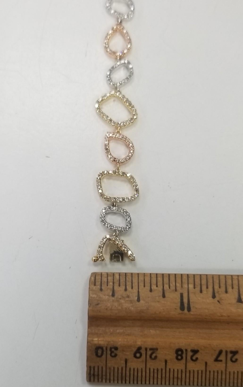 Specifications:
Custom made in Los Angeles, CA
Metal: 14K Yellow, White and Rose Gold   
Weight: 1.80 Gr
Main Stone: single cut Round diamond 1.80cttw  
Color: G
Clarity: Vs
Length: 7 Inch