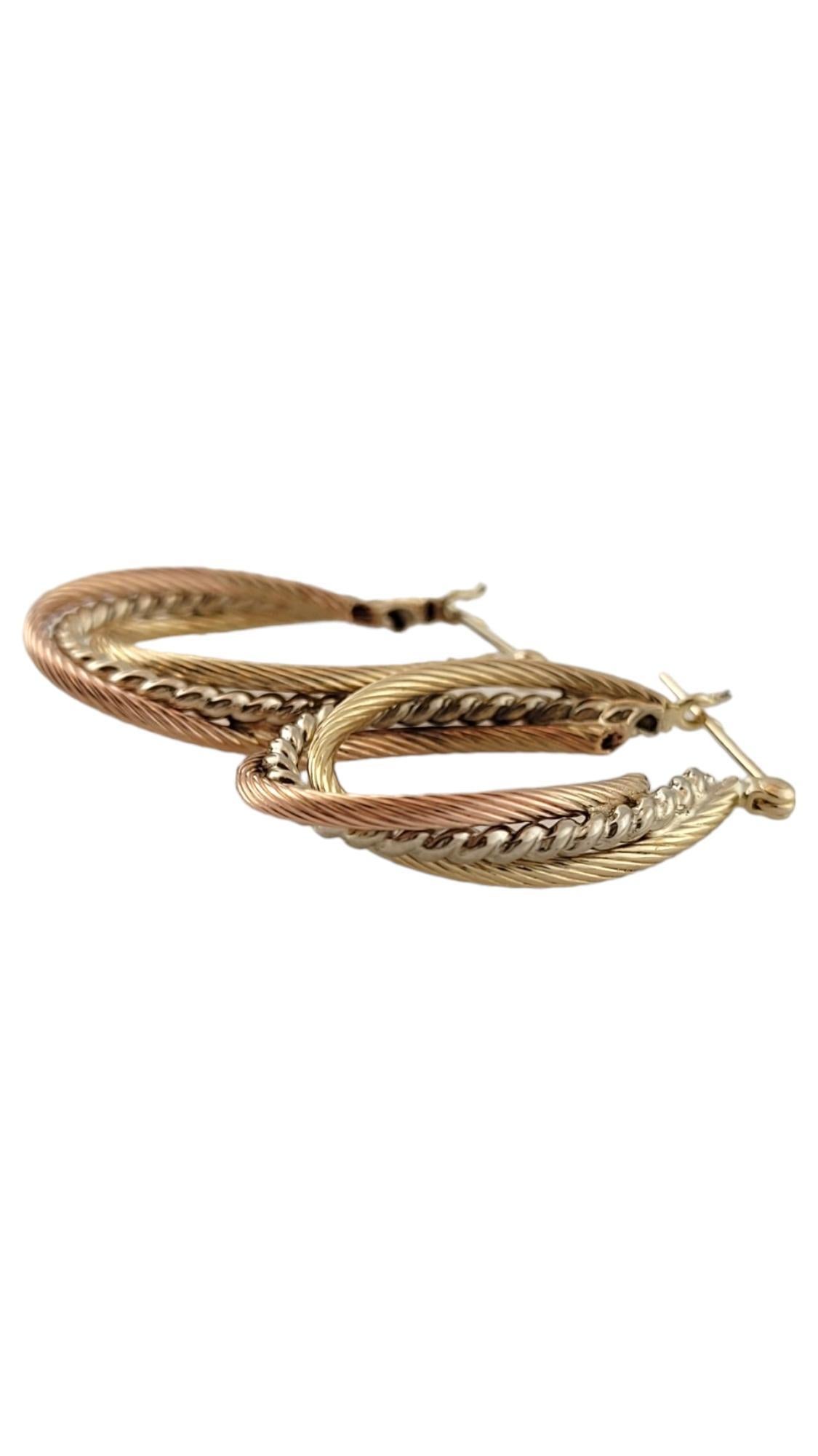 Vintage 14K Yellow, White and Rose Gold Tri-Colored Twisted Oval Hoops #16444

This beautiful set of 14K gold tri-colored oval hoops are in a gorgeous, twisted pattern that will look stunning on anyone!

Size: 28.9mm X 18.62mm X 5.18mm

Weight: 2.3