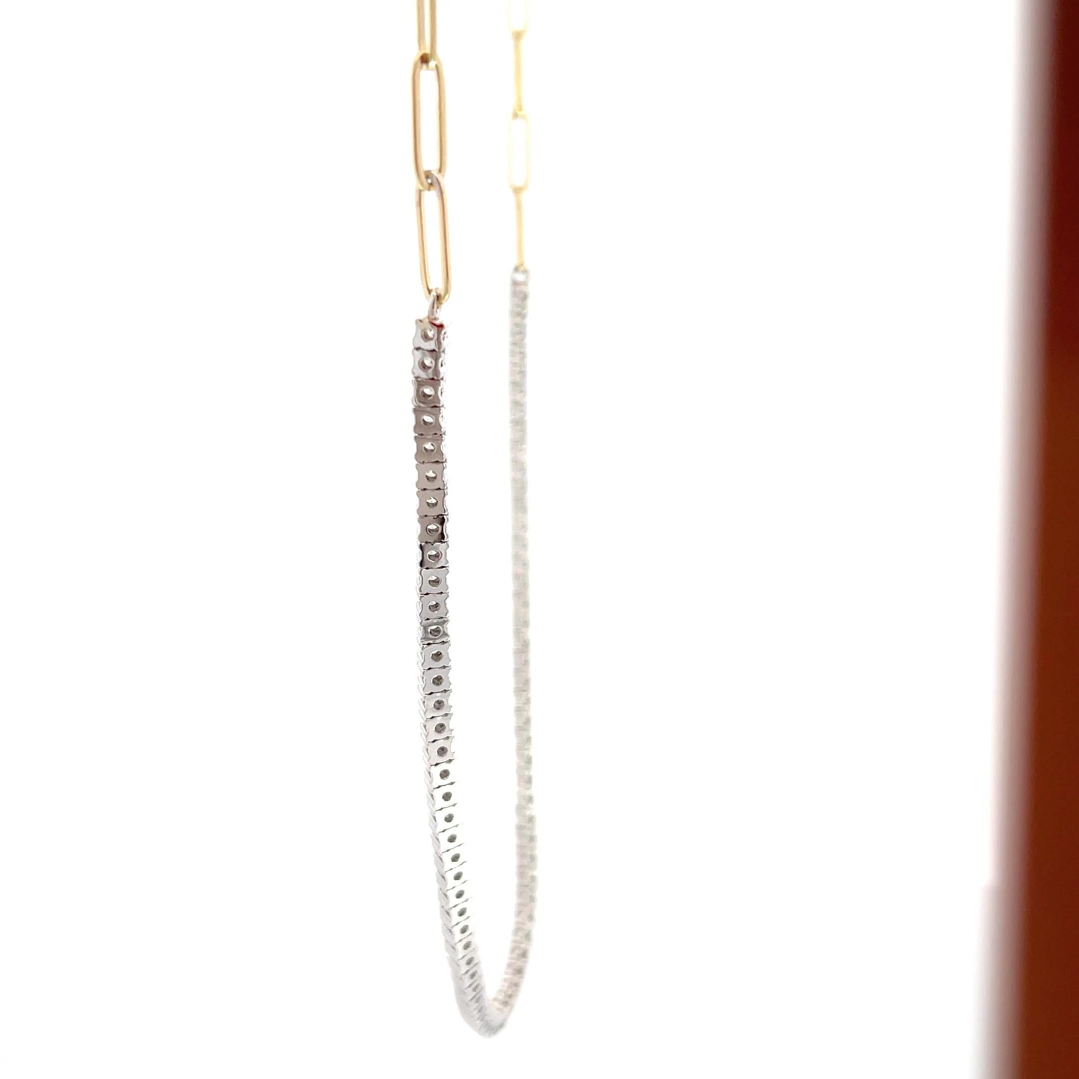 Introducing the epitome of elegance and sophistication, our 14K Yellow & White Gold 2.40ctw Diamond Tennis Necklace with a mesmerizing paperclip chain. Crafted to captivate the eye, this stunning piece exudes timeless beauty that will leave you