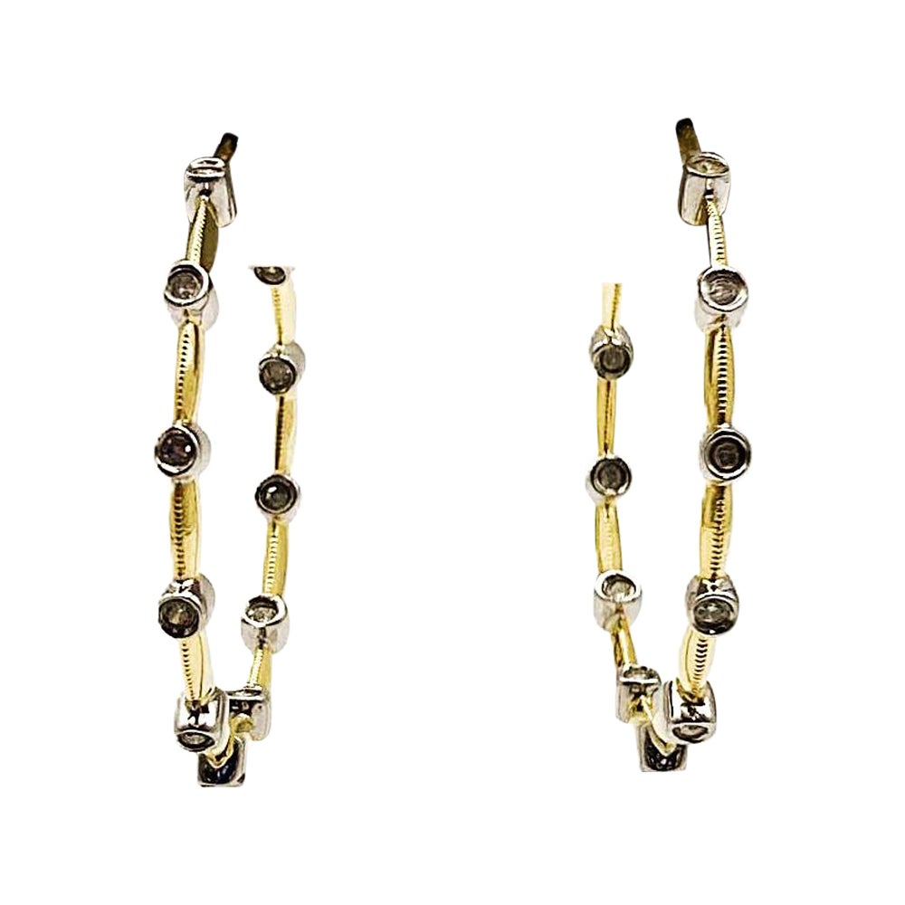 Boucles d
oreilles en or jaune et blanc 14k avec diamants de .32 carats en vente