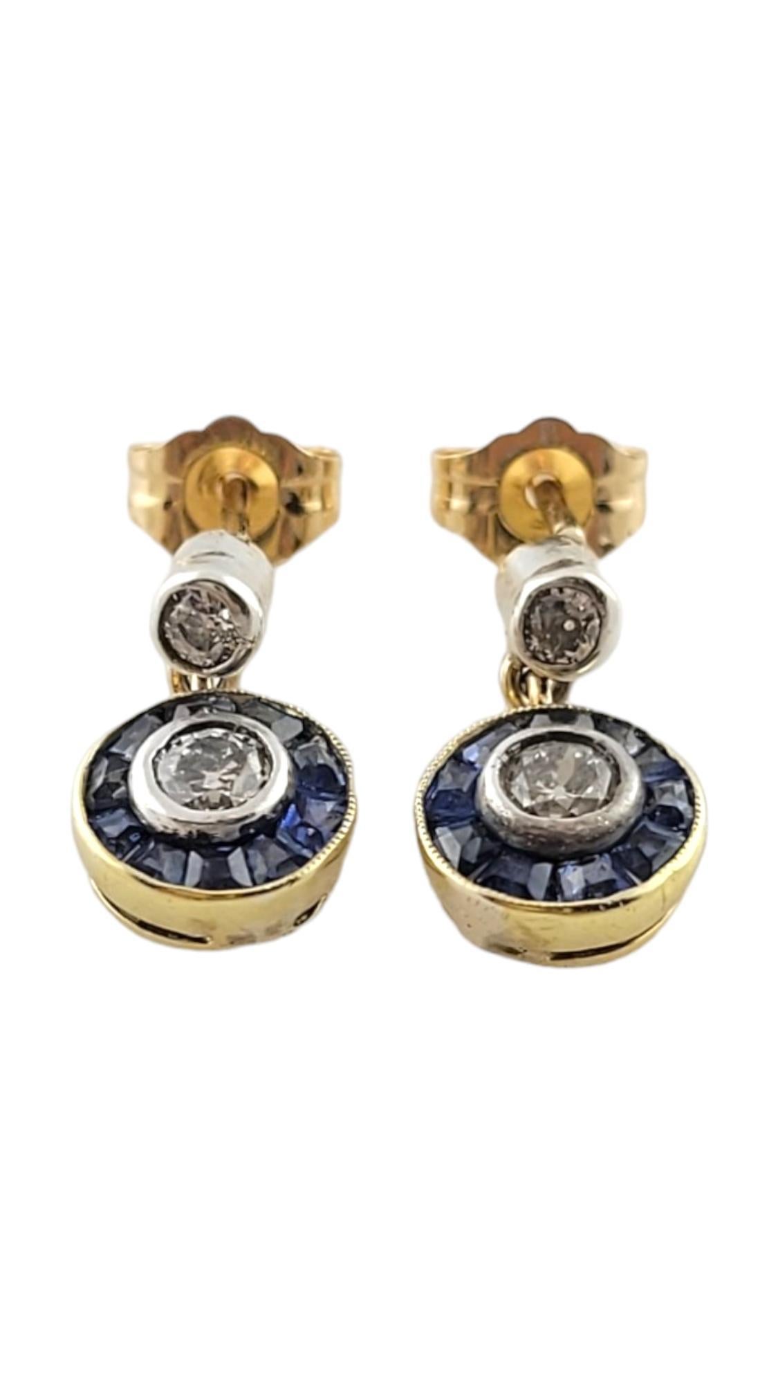 14K Yellow & White Gold Diamond & Natural Blue Sapphire Drop Dangle Earrings

This stunning set of drop dangle earrings were meticulously crafted from 14K yellow and white gold and features two early modern brilliant cut diamonds, two round cut