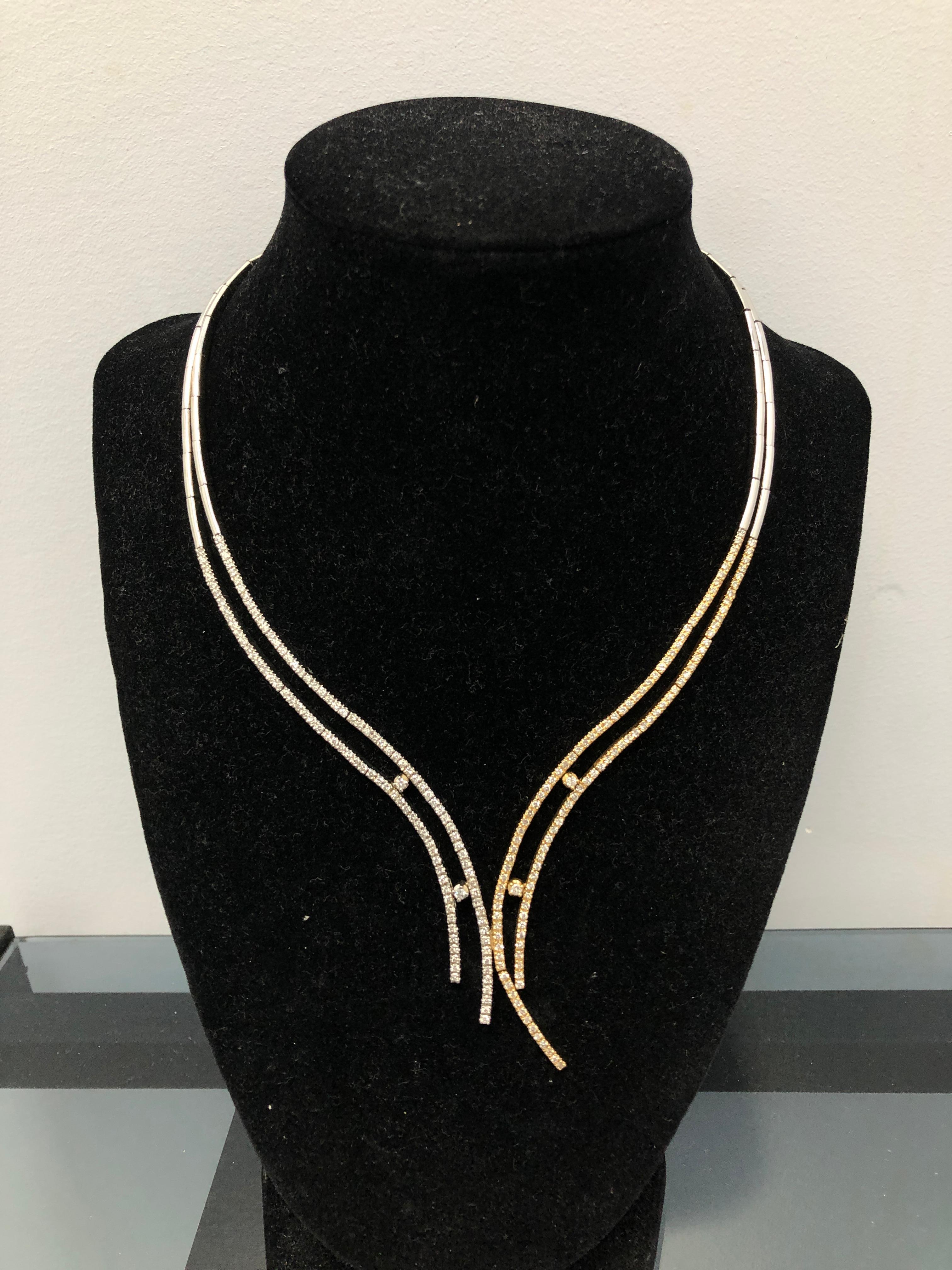 A 14K two tone gold necklace containing 220 round brilliant-cut diamonds weighing approximately 2.25 carats total.

Stone: Diamond

Metal: 14K Yellow & White Gold

Size: 15
