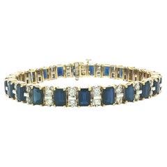 Bracciale in oro giallo e bianco 14k con zaffiro e diamante taglio smeraldo da 19,55 ct.