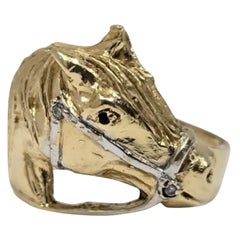 Anello equestre con testa di cavallo in oro giallo e bianco 14K
