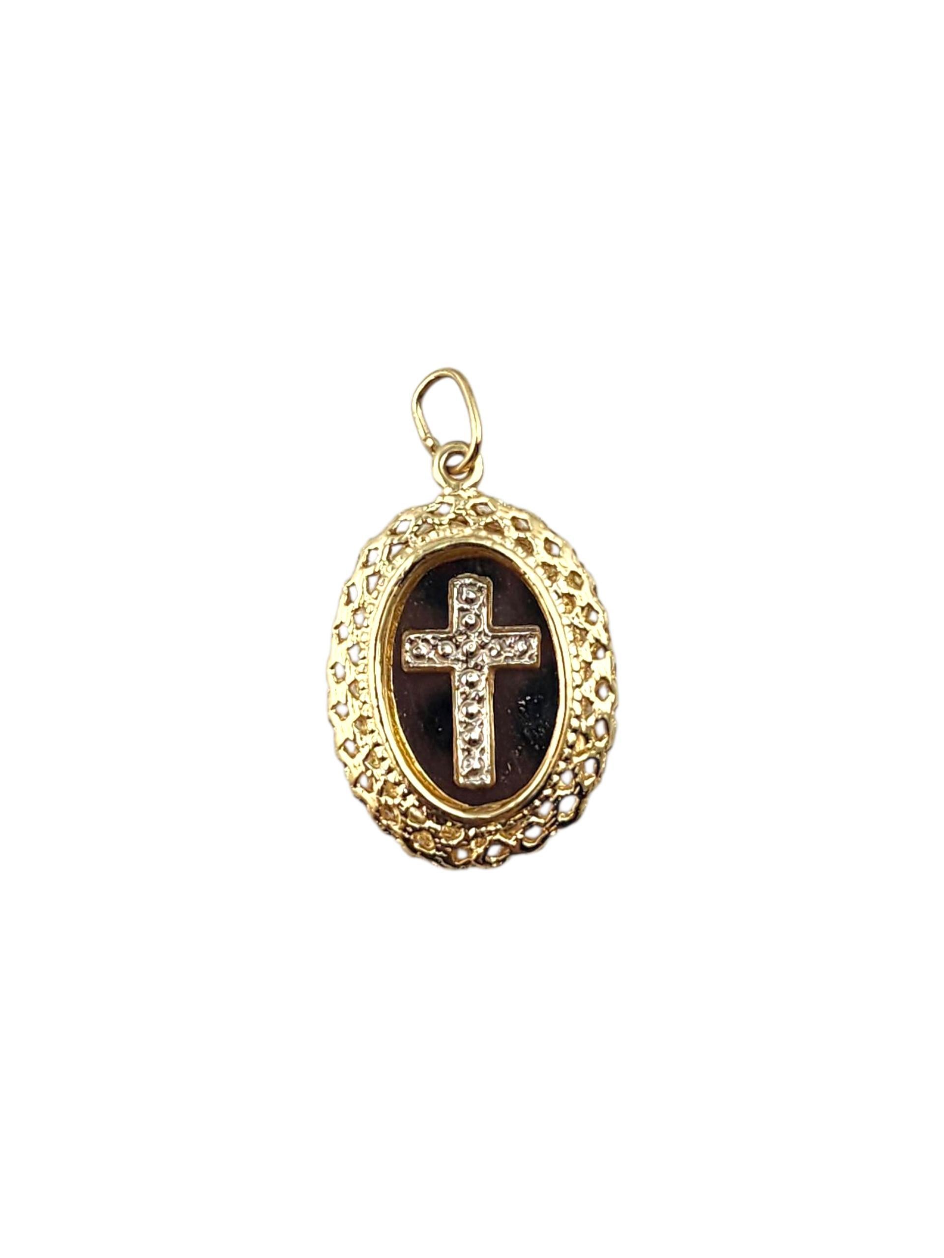 14K Yellow & White Gold Oval Framed Cross Pendant -

This yellow and white gold oval cross pendant beautifully blends two-tone elegance with timeless symbolism. The graceful oval frame encircles a polished cross, representing faith, unity, and