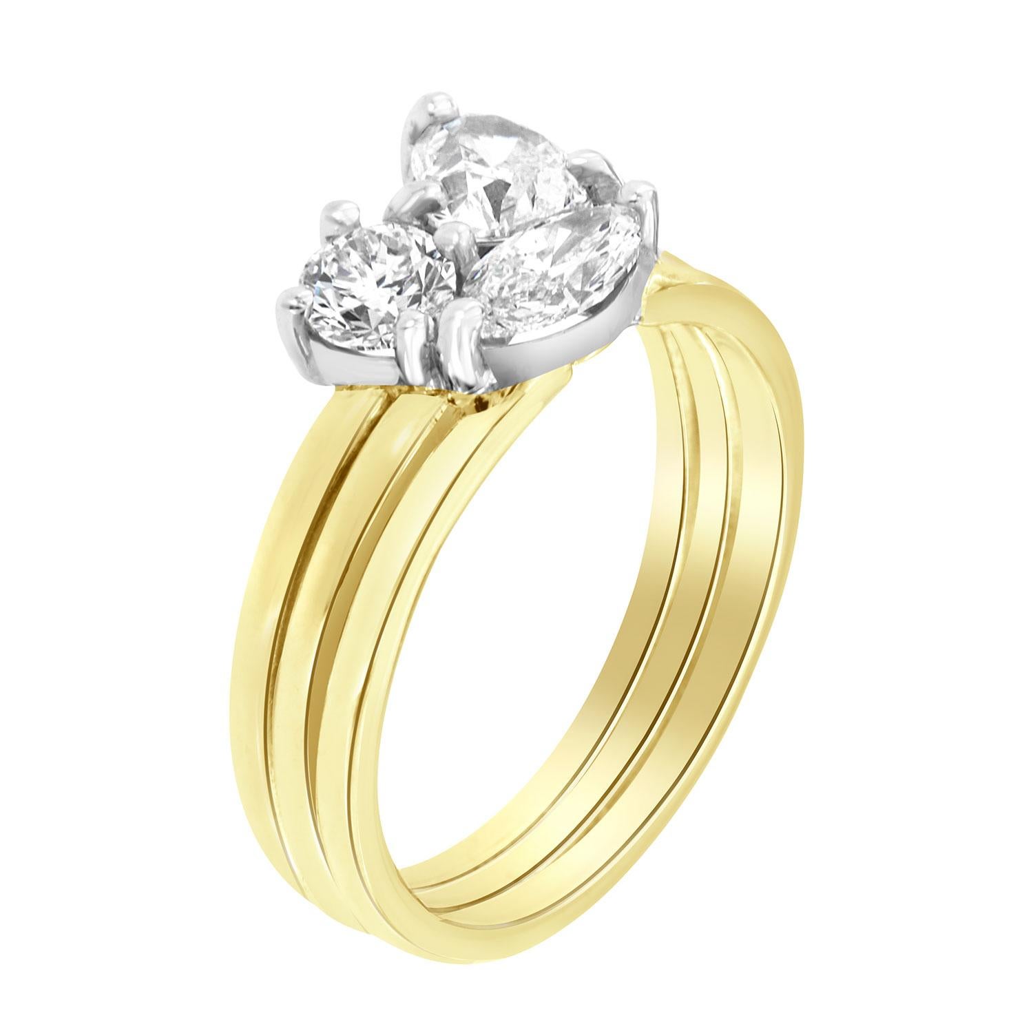This one-of-a-kind original designed ring features three mixed-shaped diamonds. This harmonious collaboration of  Heart, Round, and Marquise is set in white gold on a 4.8 MM tube yellow gold band. All three diamonds are GIA certified.

Diamond