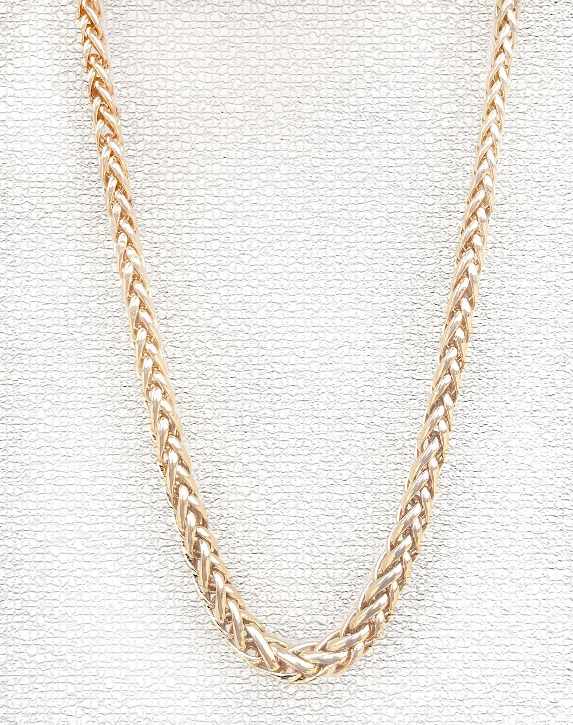 Ladies 14k Yellow Gold Tapered Hollow Braided Necklace in a high polish finish.  This 18