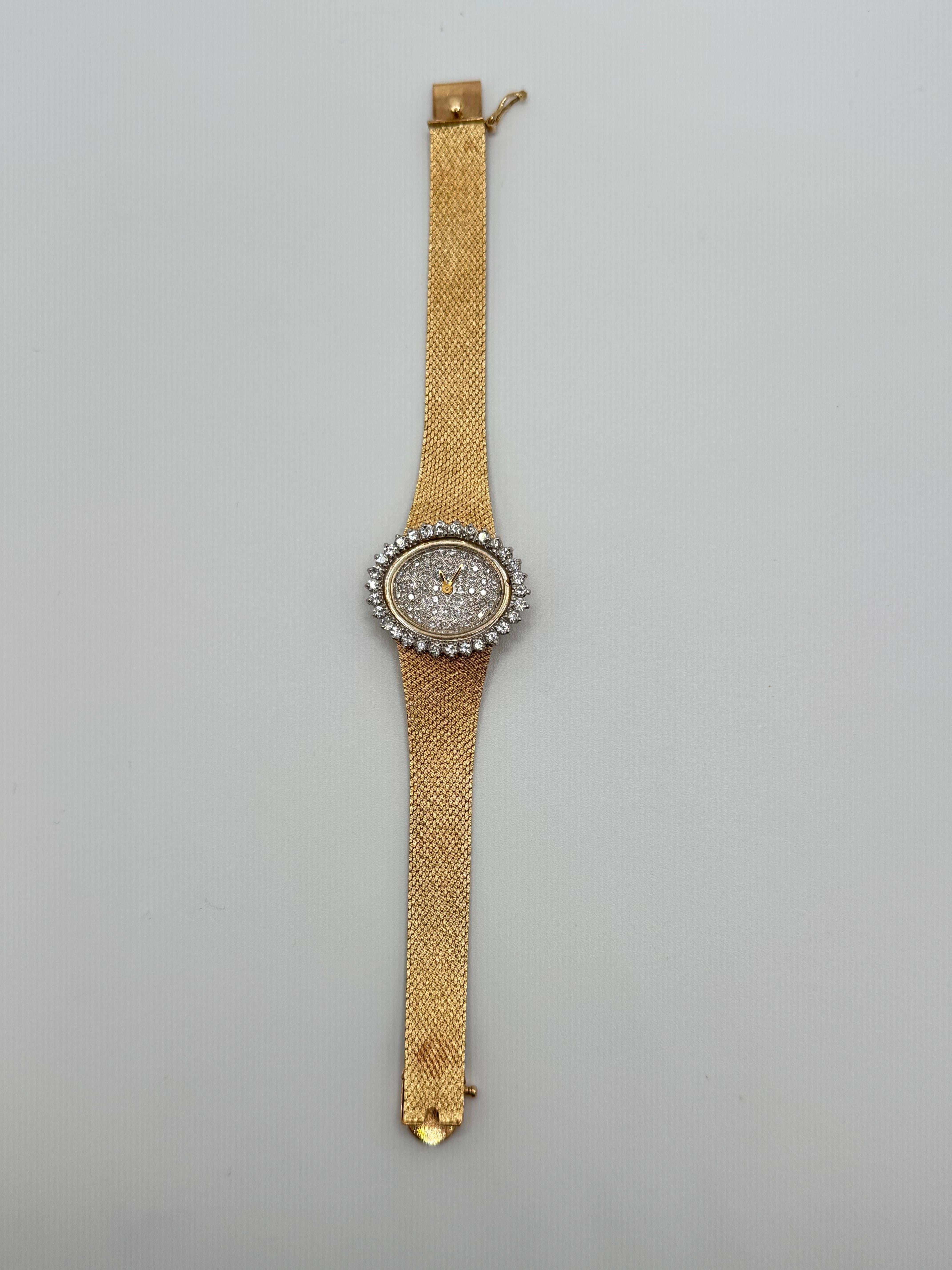 This luxurious 14K yellow gold Lids watch features a high-quality ETA movement and showcases exceptional diamond detailing. The round case is framed with 30 round brilliant-cut diamonds, each approximately 0.05 carats, bezel-set in secure prongs for