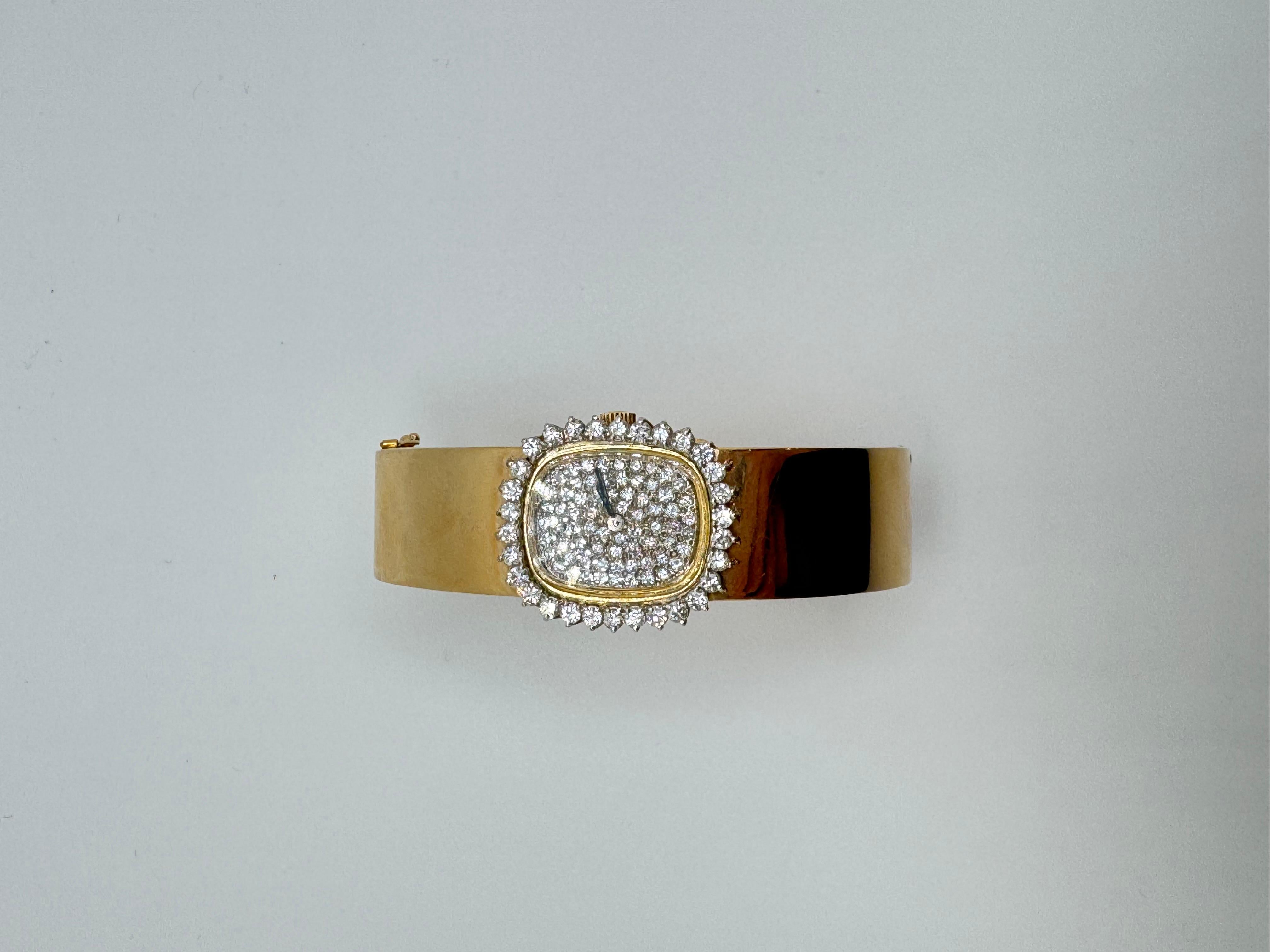 This exquisite Omega diamond bangle watch showcases timeless elegance and exceptional craftsmanship. Featuring a central diamond surrounded by a brilliant pavé-set design, the total carat weight is approximately 1.65 carats. The bezel is accented