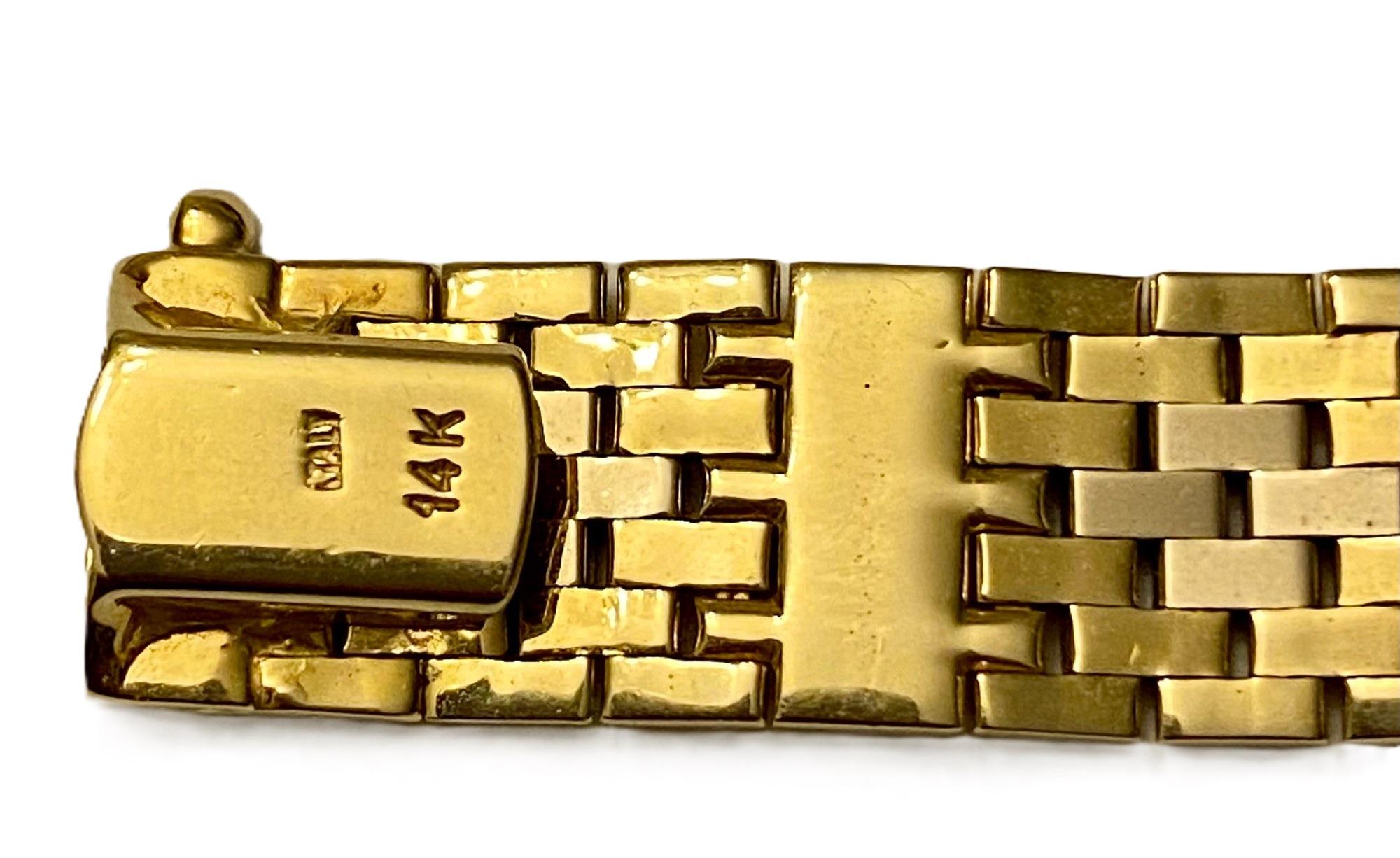 This is a very elegant and rich looking bracelet.  It is made of the finest Italian Gold.  It just feels smooth and silky.   It is 14k Yellow Gold and measures 7.25 inches long and .45 inches wide.  It's nice and flexible and conforms very nicely to