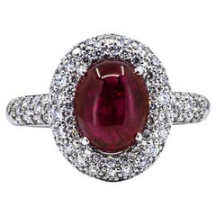 Anello con cabochon di rubino in oro bianco 14kl