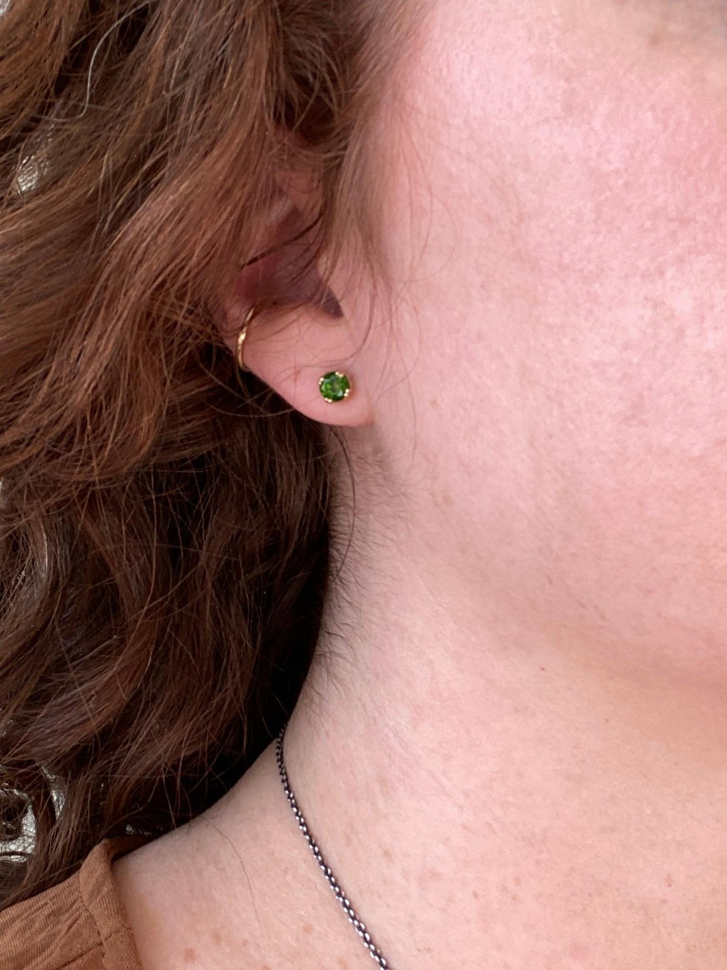 We love the HEARTS on the sides of the settings! Who wants plain studs when you can have heart detail studs instead?

These adorable studs have two great features: 1) GLORIOUSLY colored diopsides and 2) adorable heart detailed settings. 

The