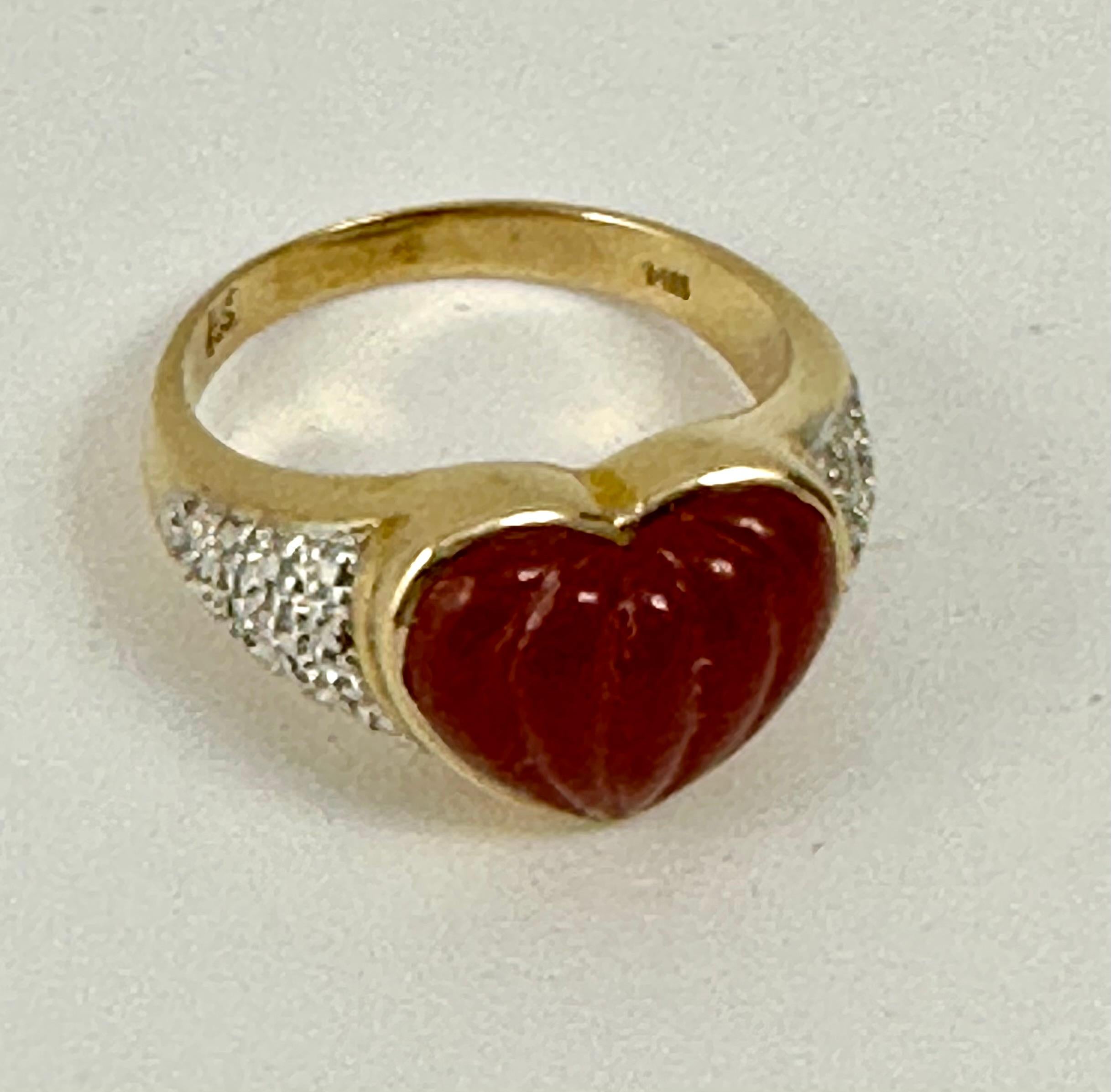 14kt 2 Tone  Yellow White Gold 13mm Wide Jade Heart Ring Size 9 1/2

Jade is a gemstone that has existed for thousands of years. For the people of Central America and China, this stone was of great value, and at some point in history, became more