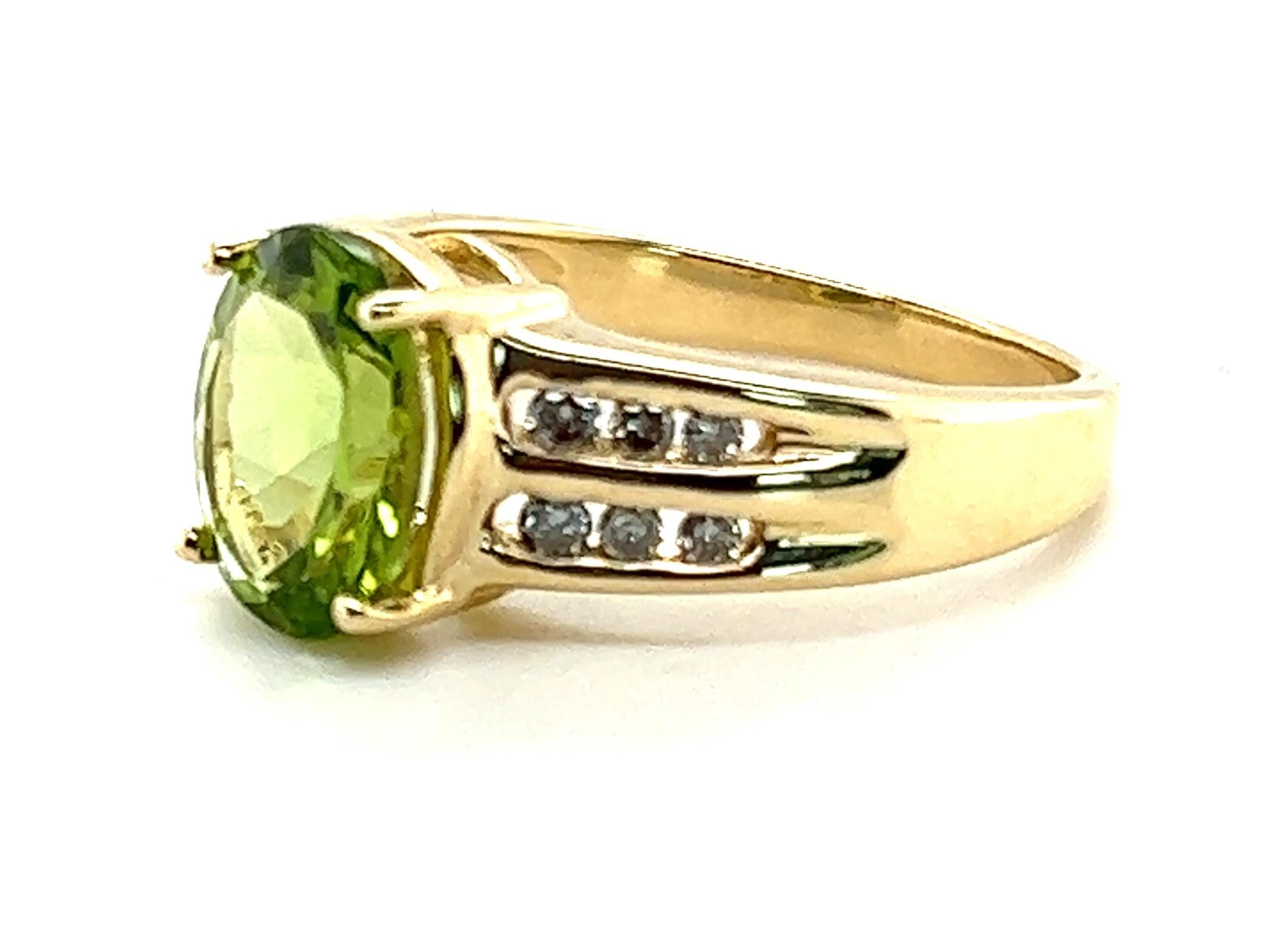 What do you get an August Baby? This peridot ring, of course!

This ring has an exceptional color peridot that's cut for maximum sparkle. The peridot weighs approximately 2.44 carats. The side of the ring contains channel set diamonds weighing