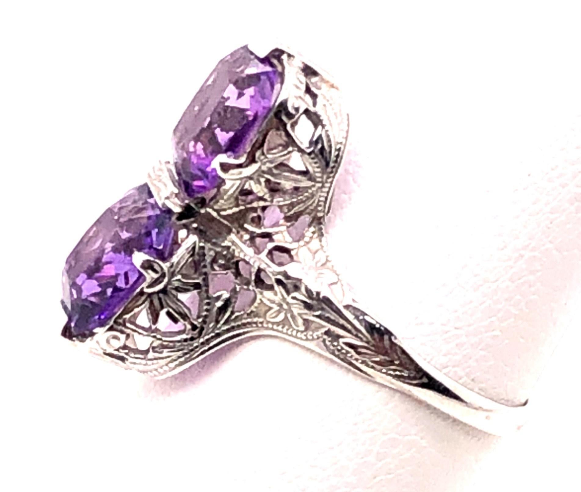 14kt white gold Art Deco Ring with two elongated cushion style cut gems. This style of ring is known as a Toi et Moi ring. Toi et Moi is French for 