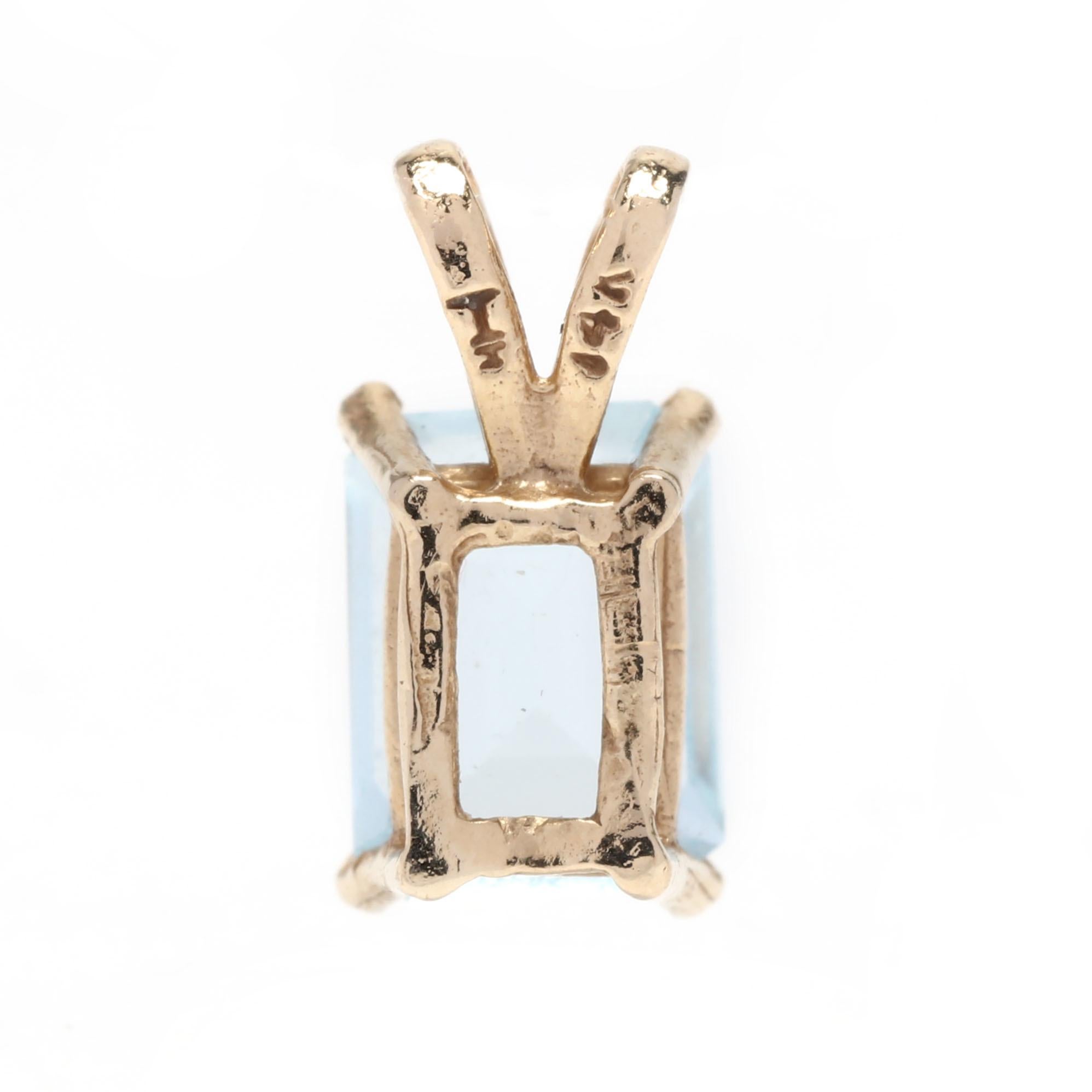 A 14 karat yellow gold emerald cut blue topaz pendant. This pendant features a prong set, emerald cut light blue topaz stone weighing approximately 2 carats and with a split bail.



Stones:

- blue topaz, 1 stone

- emerald cut

- 8 x 6 mm

-