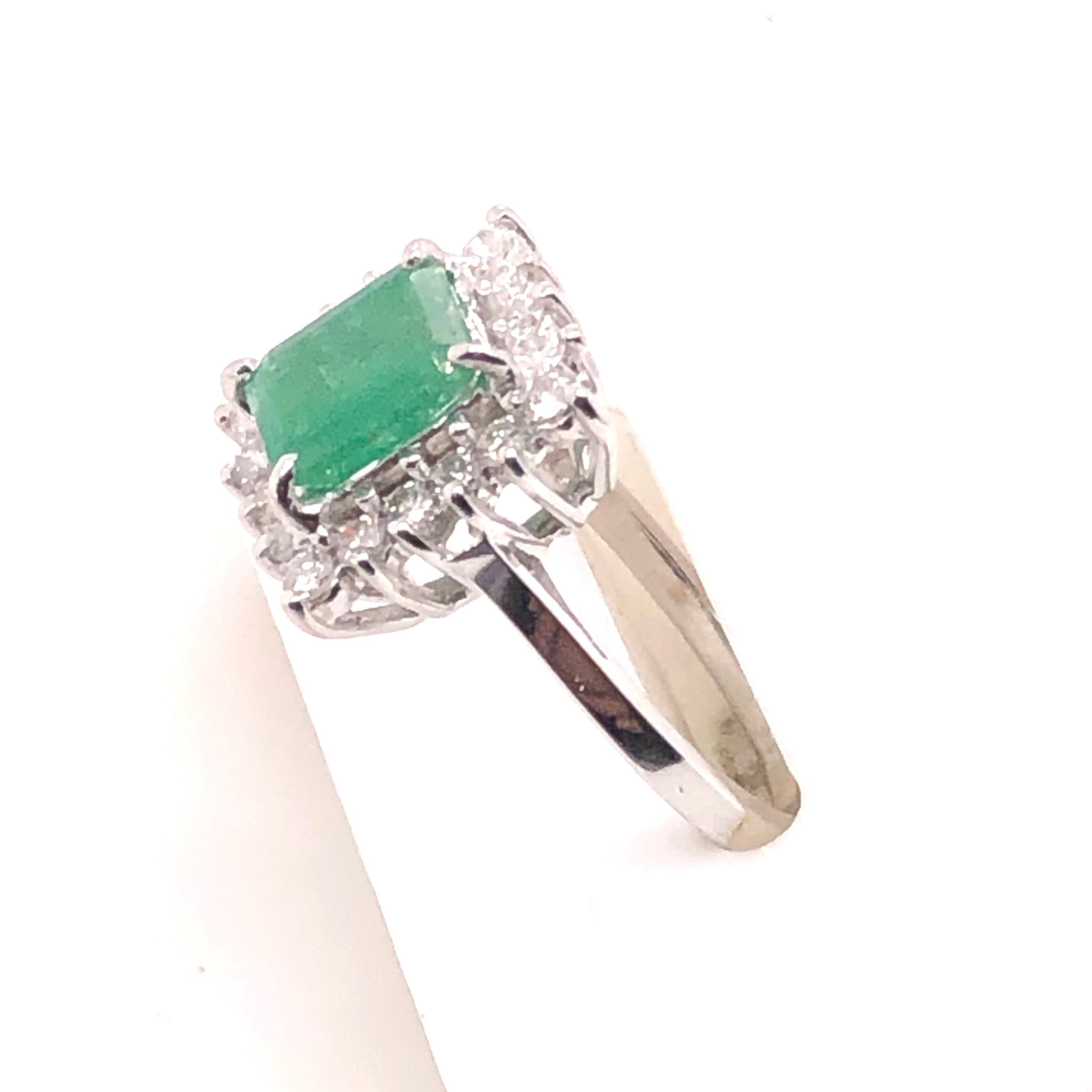 14kt Emerald Cut Emerald Ring with Diamond Halo In Good Condition In Towson, MD