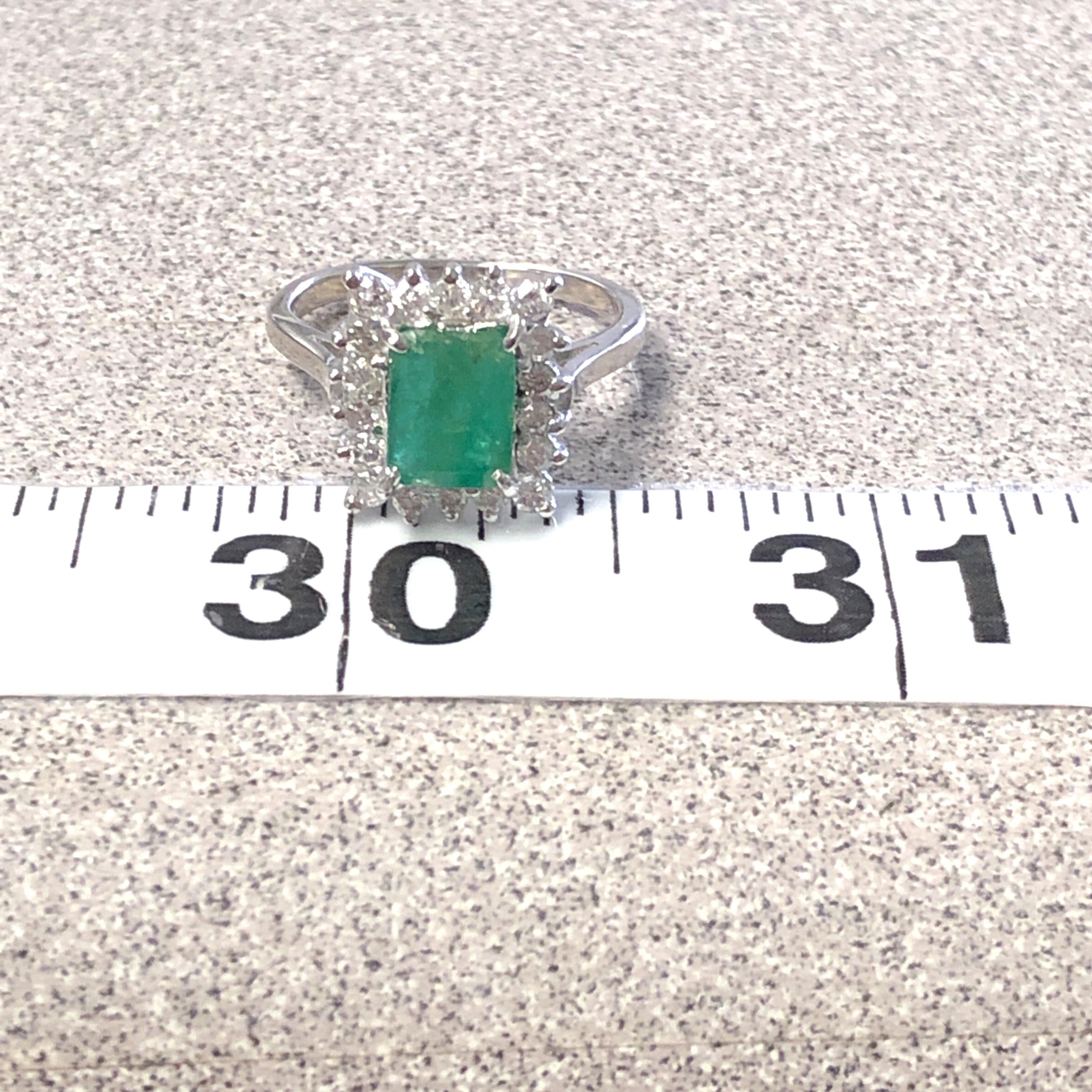 14kt Emerald Cut Emerald Ring with Diamond Halo 3