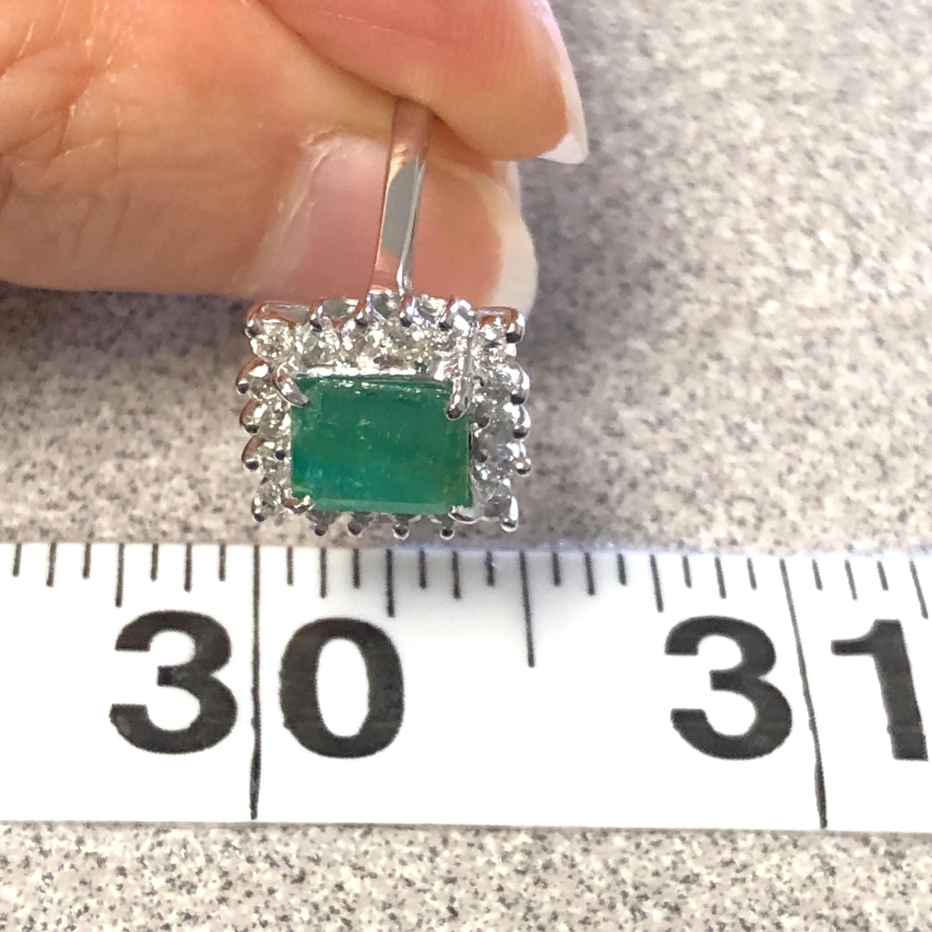14kt Emerald Cut Emerald Ring with Diamond Halo 4