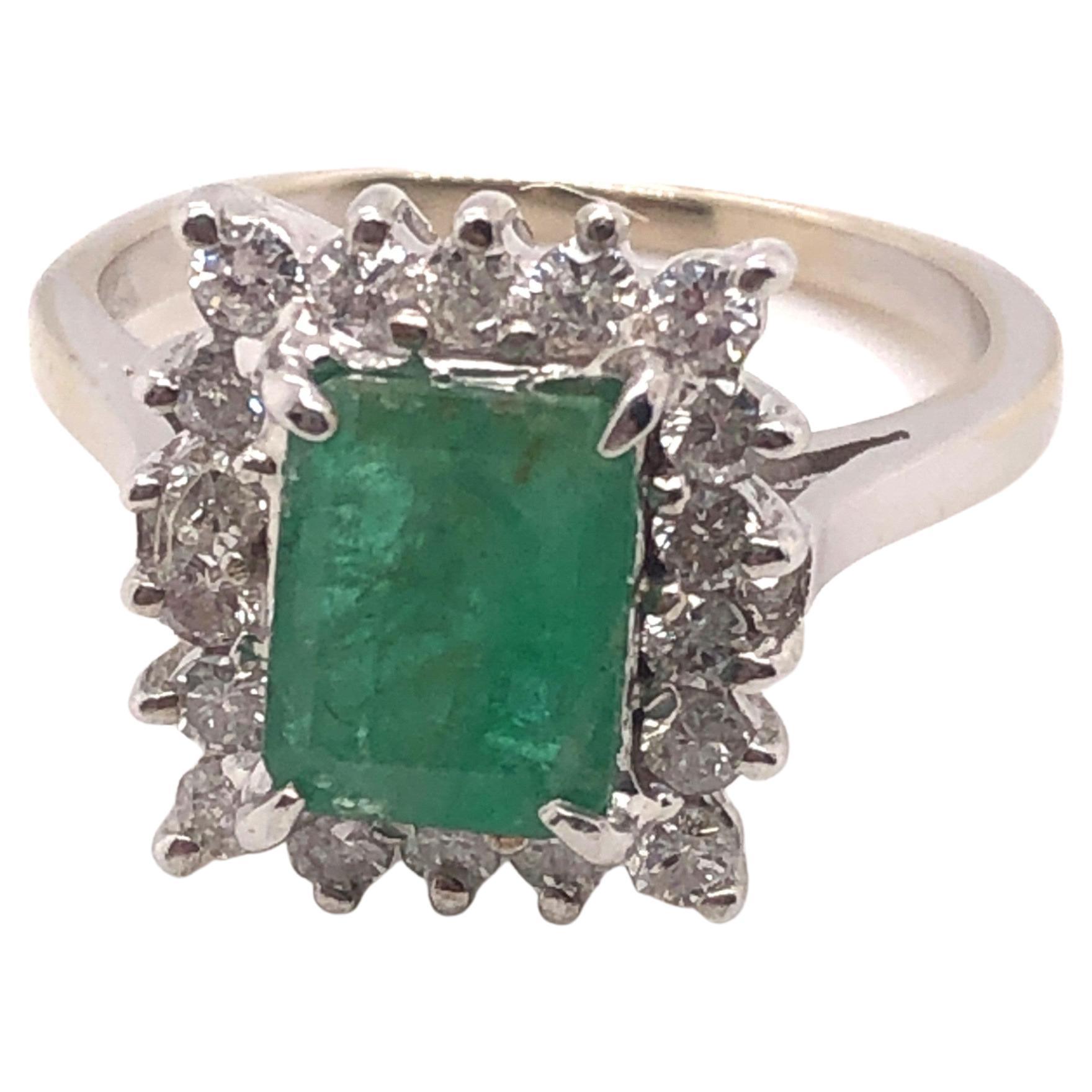 14kt Emerald Cut Emerald Ring with Diamond Halo