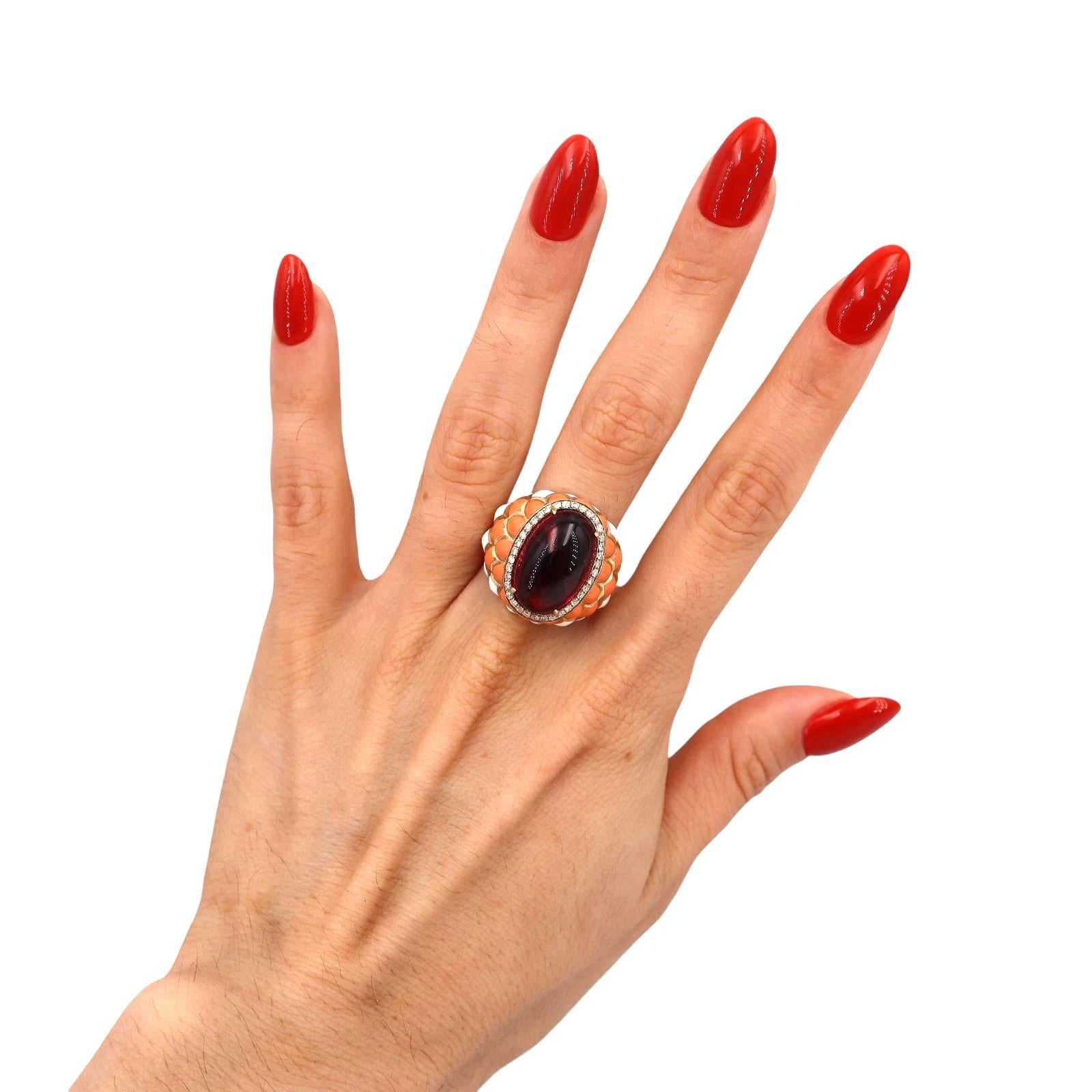 Introducing a stunning 14kt yellow gold ring that beautifully combines elegance and artistry. This exquisite piece features vibrant applications of white and orange enamel, creating a striking contrast that enhances its overall design.

At the