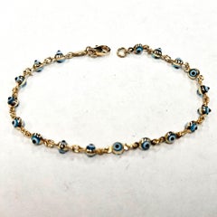 Bracciale Malocchio in oro 14kt con charme in vetro blu, bianco e nero, Made in USA
