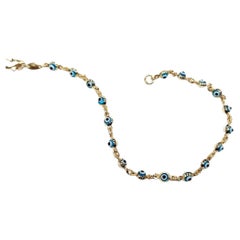 Bracciale Malocchio in oro 14kt con charme in vetro blu, bianco e nero, Made in USA