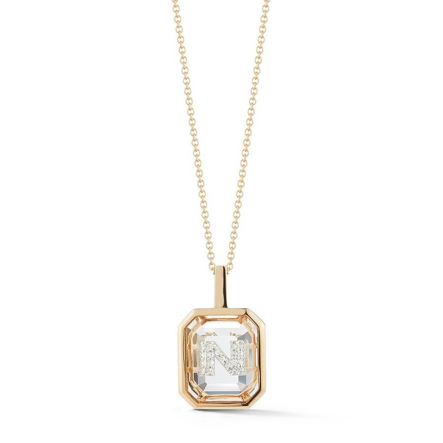 Beautifully handcrafted in New York of solid 14K Yellow Gold set with our special emerald cut crystal quartz. The personalized diamond pave initial is then set/hidden underneath the gemstone.

Our gemstone initial collection offers an elevated take