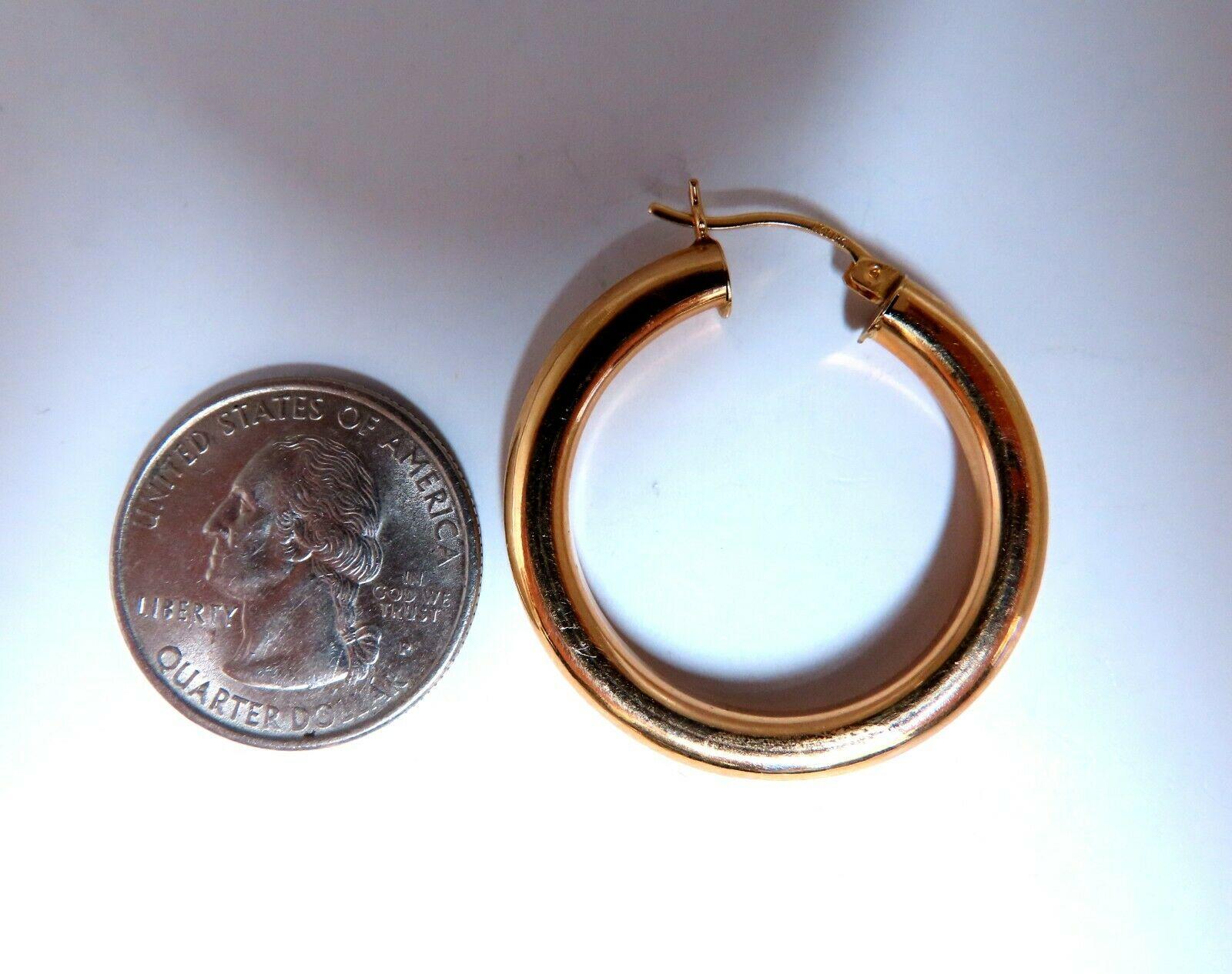 Gold Hoop Earrings

Measurements of Earrings:

32mm diameter / 1.30 inch

5mm wide.

4.4 grams / 14kt. yellow gold

Earrings are gorgeous made