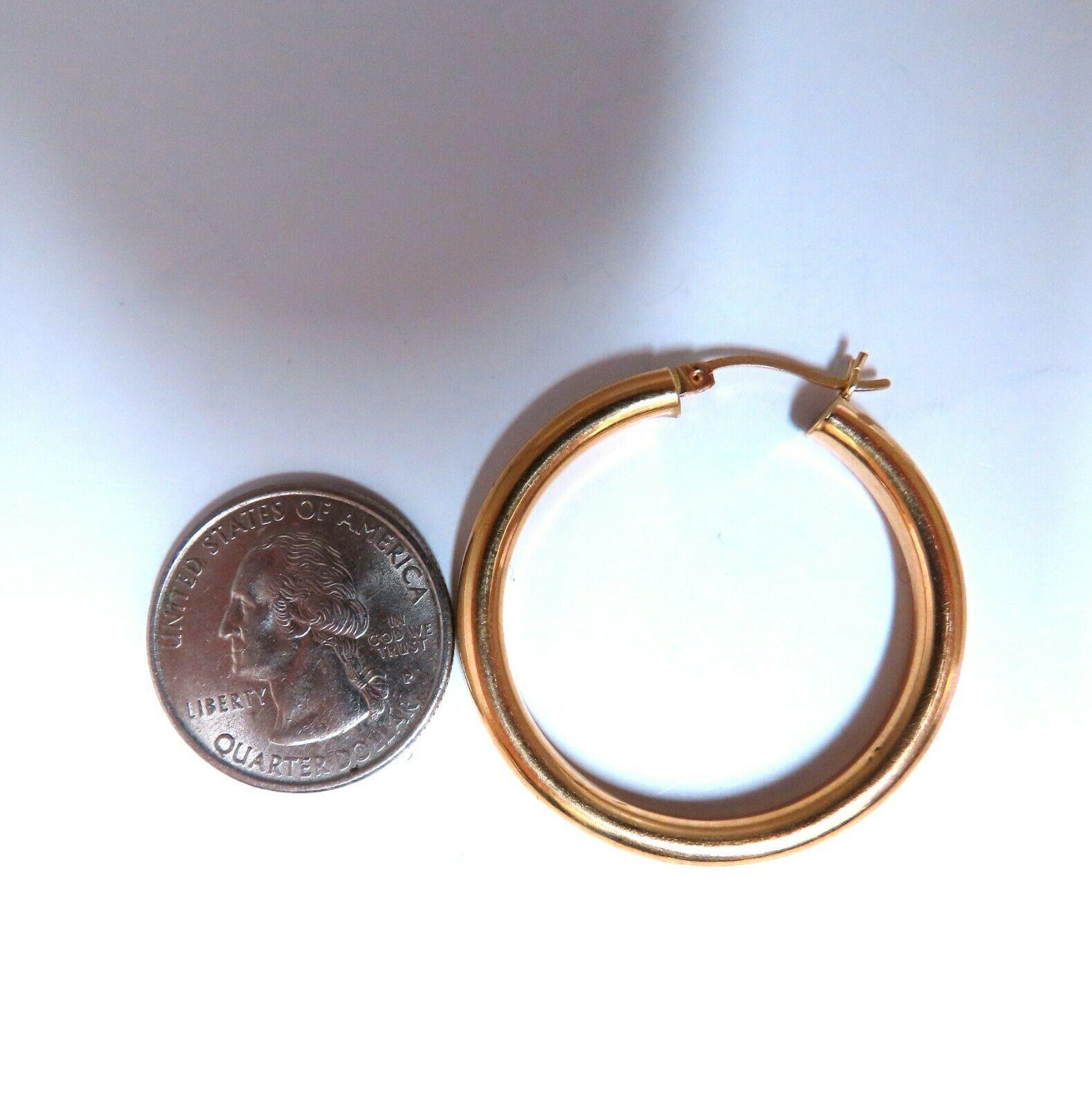 Gold Hoop Earrings

Measurements of Earrings:

37mm diameter / 1.46 inch

4mm wide.

4.8 grams / 14kt. yellow gold

Earrings are gorgeous made