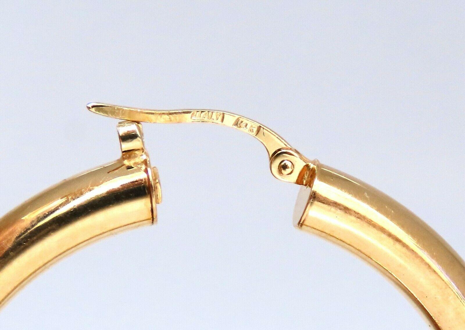Gold Hoop Earrings

Measurements of Earrings:

37mm diameter.

4mm wide.

5 grams / 14kt. yellow gold

Earrings are gorgeous made