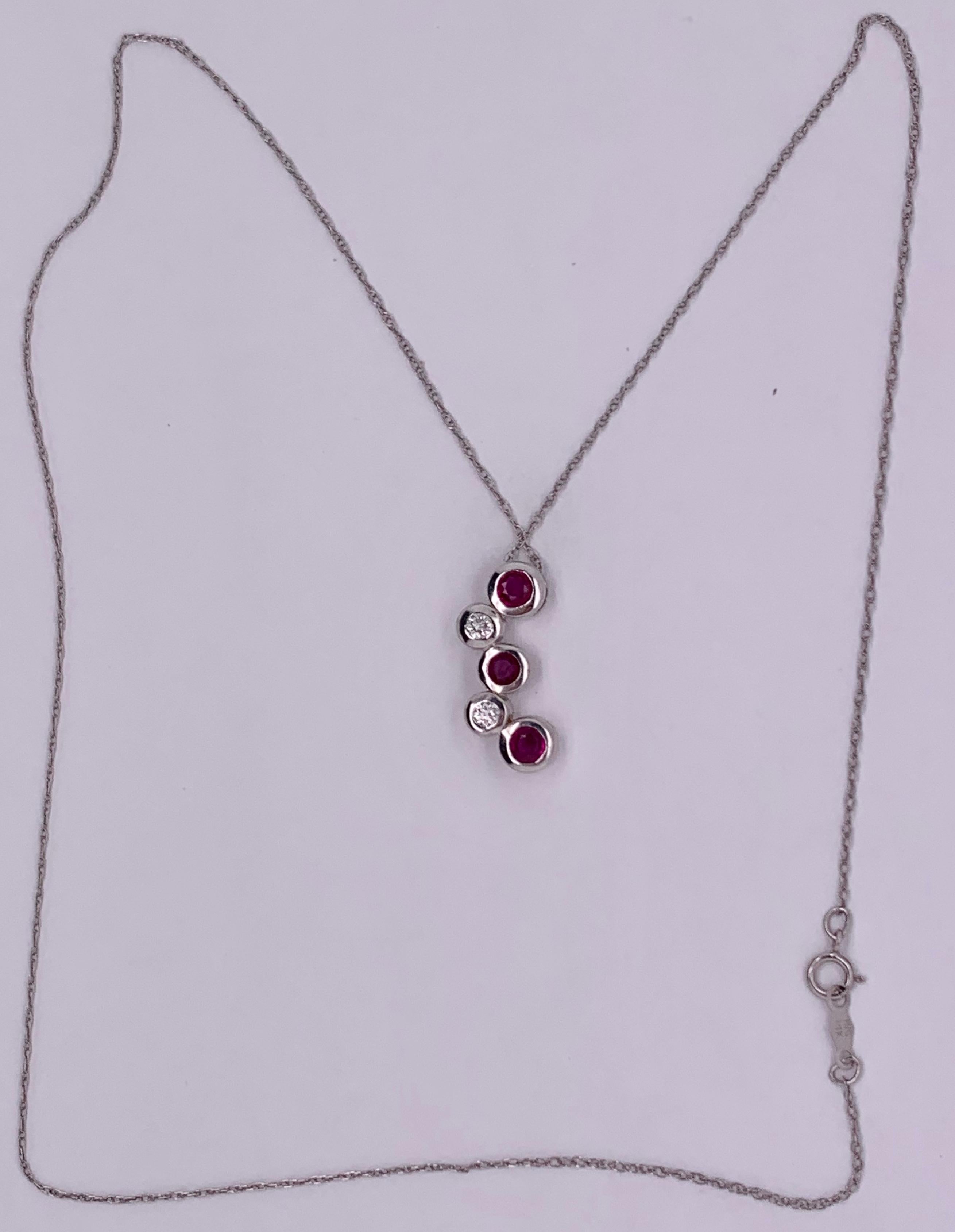 14kt Gold 3 Ruby and 2 Diamond, .14TDW Necklace 4 Grams Total on a 16 inch Necklace. 