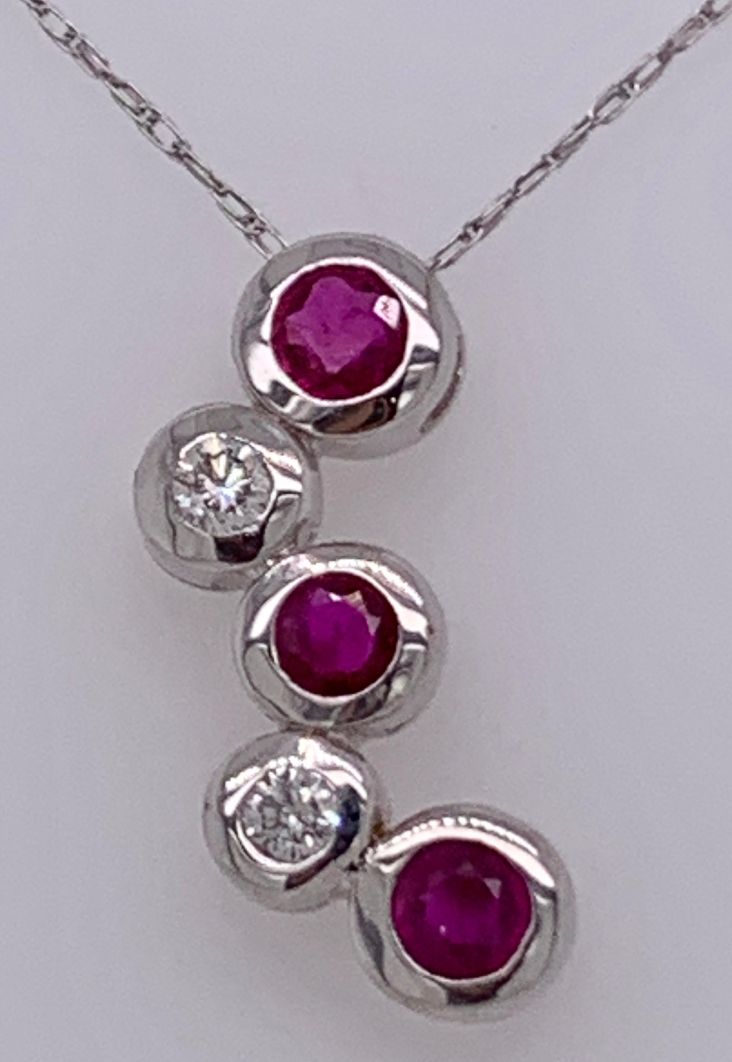 Women's or Men's 14kt Gold Ruby and Diamond Necklace Having 3 Rubies and 2 Round Diamonds For Sale
