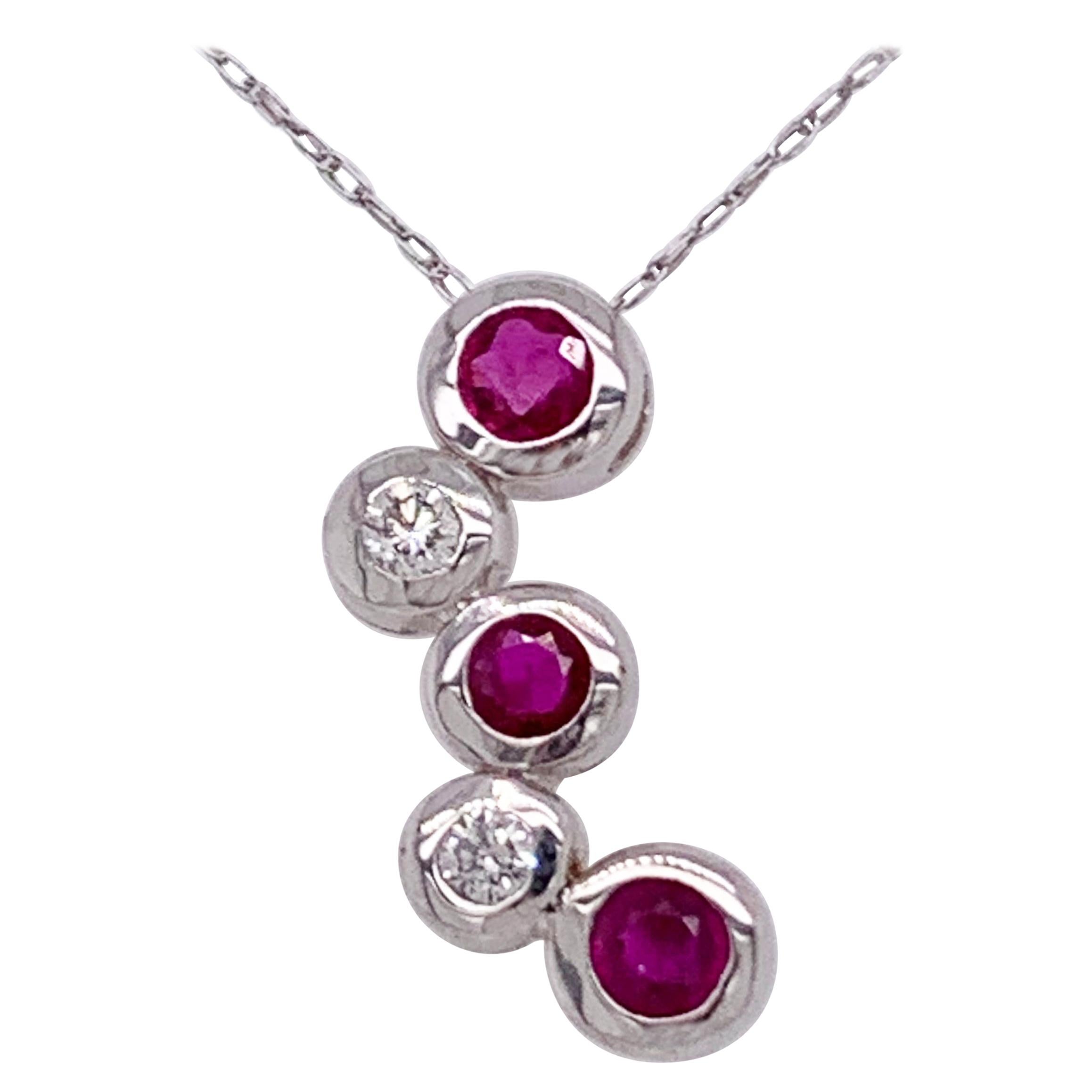 14kt Gold Ruby and Diamond Necklace Having 3 Rubies and 2 Round Diamonds For Sale