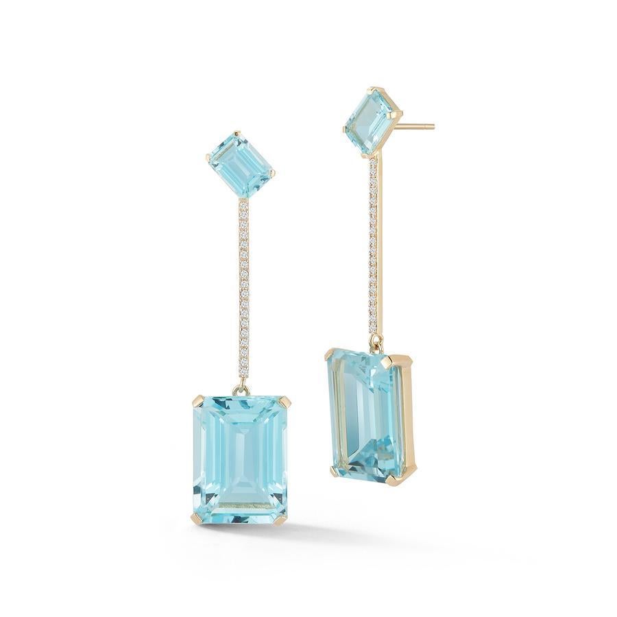 Beautifully made in New York of solid 14kt yellow gold, emerald cut blue topaz  and set with brilliant diamonds.  These strikingly beautiful earrings are the perfect way to add color to ones look and stand out.