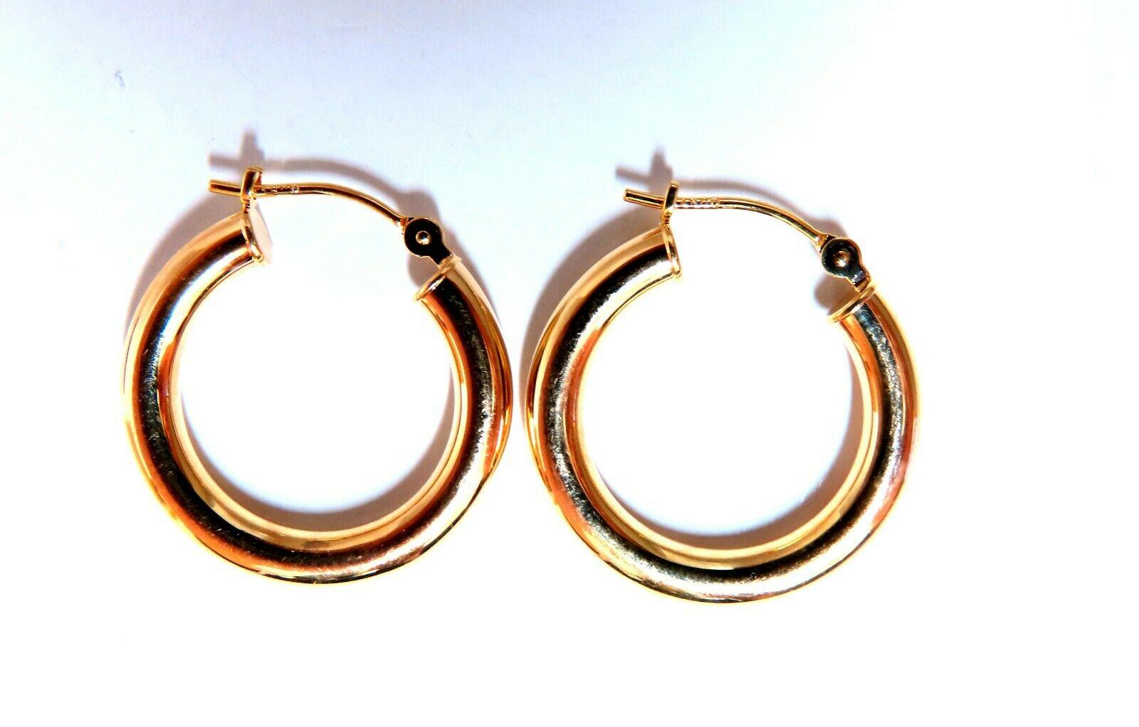 Classic Tubular Hoop Earrings

Measurements of Earrings:

20mm diameter

2.8mm tube.

1.2 grams / 14kt. Yellow gold

Earrings are gorgeous made