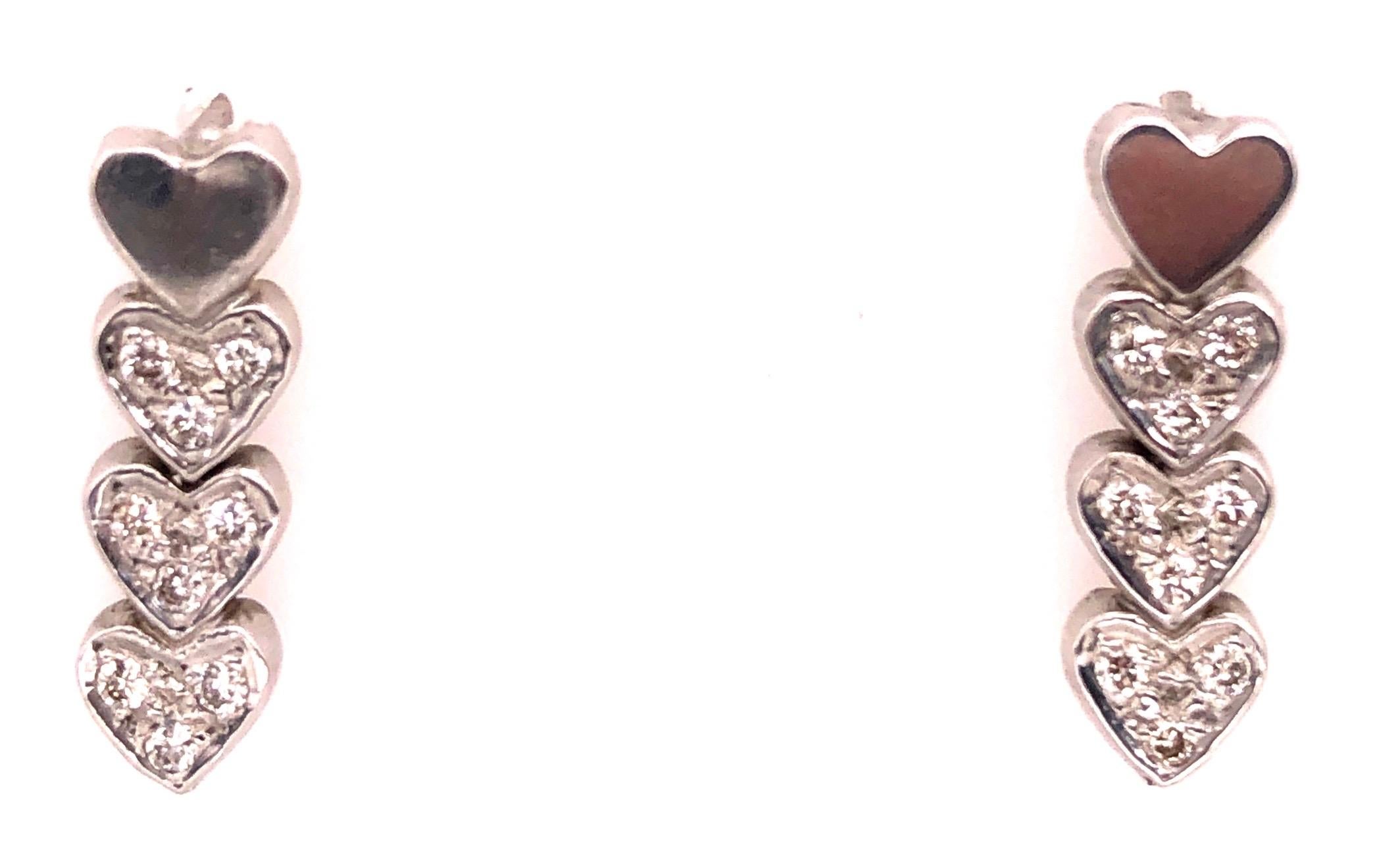 14Kt Heart Screw Back Earrings with 18 Diamonds 2 grams total weight.