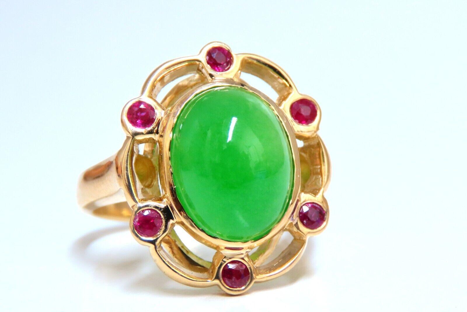 Jade ring.

Jade measures 12 x 10mm.

Impregnated, treated, and dyed.

. 50ct natural round rubies.

Full cut rounds

Clean clarity and transparent

Depth of ring 10 mm

Deck of Ring 21 x 18mm

14 karat yellow gold 8.6 grams

Size 7.75 and we may