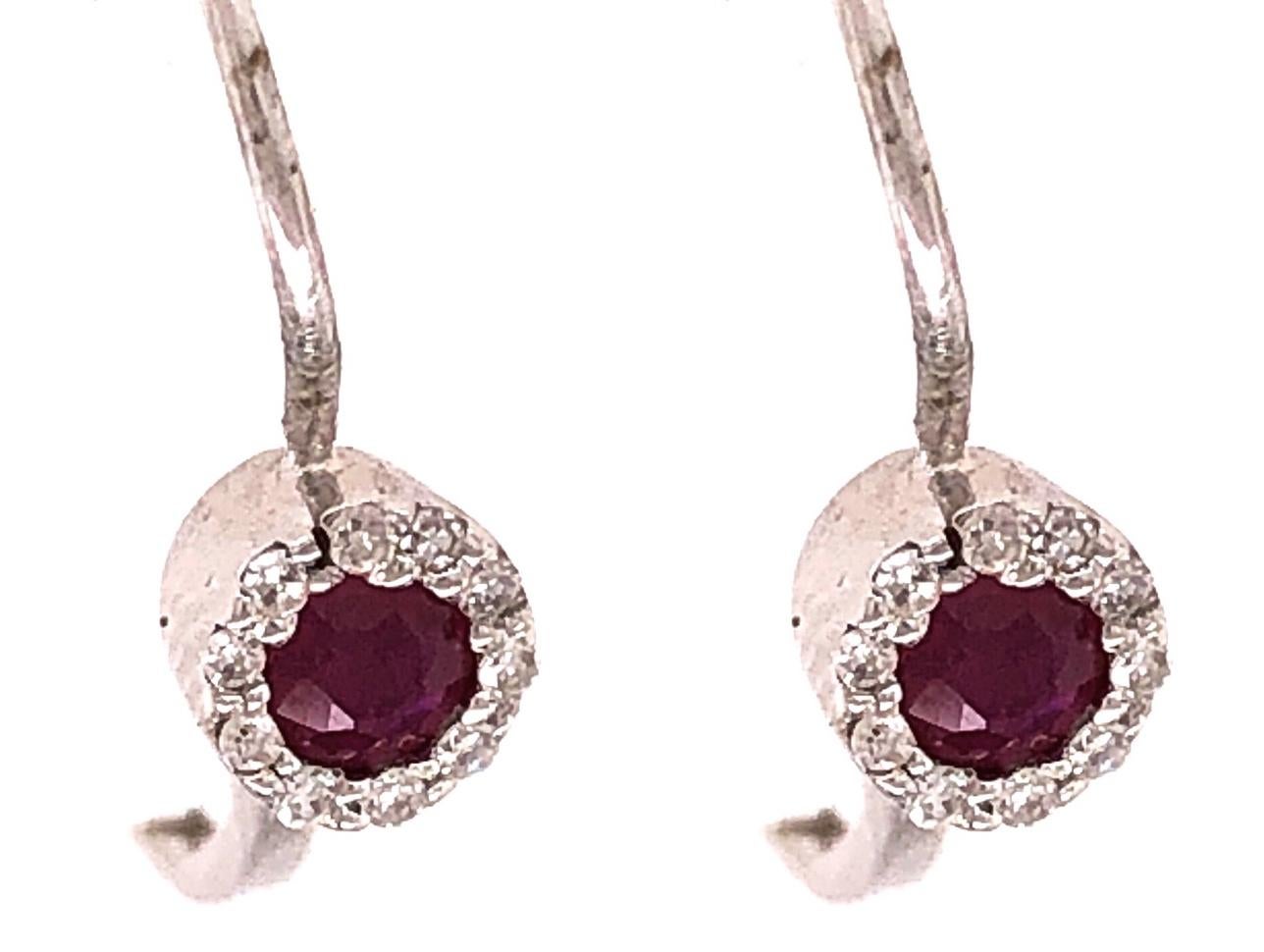 14Kt Lever Back Pink Topaz with Diamond Earrings 1.08 grams total weight. Stamped 585
20 total diamond.



