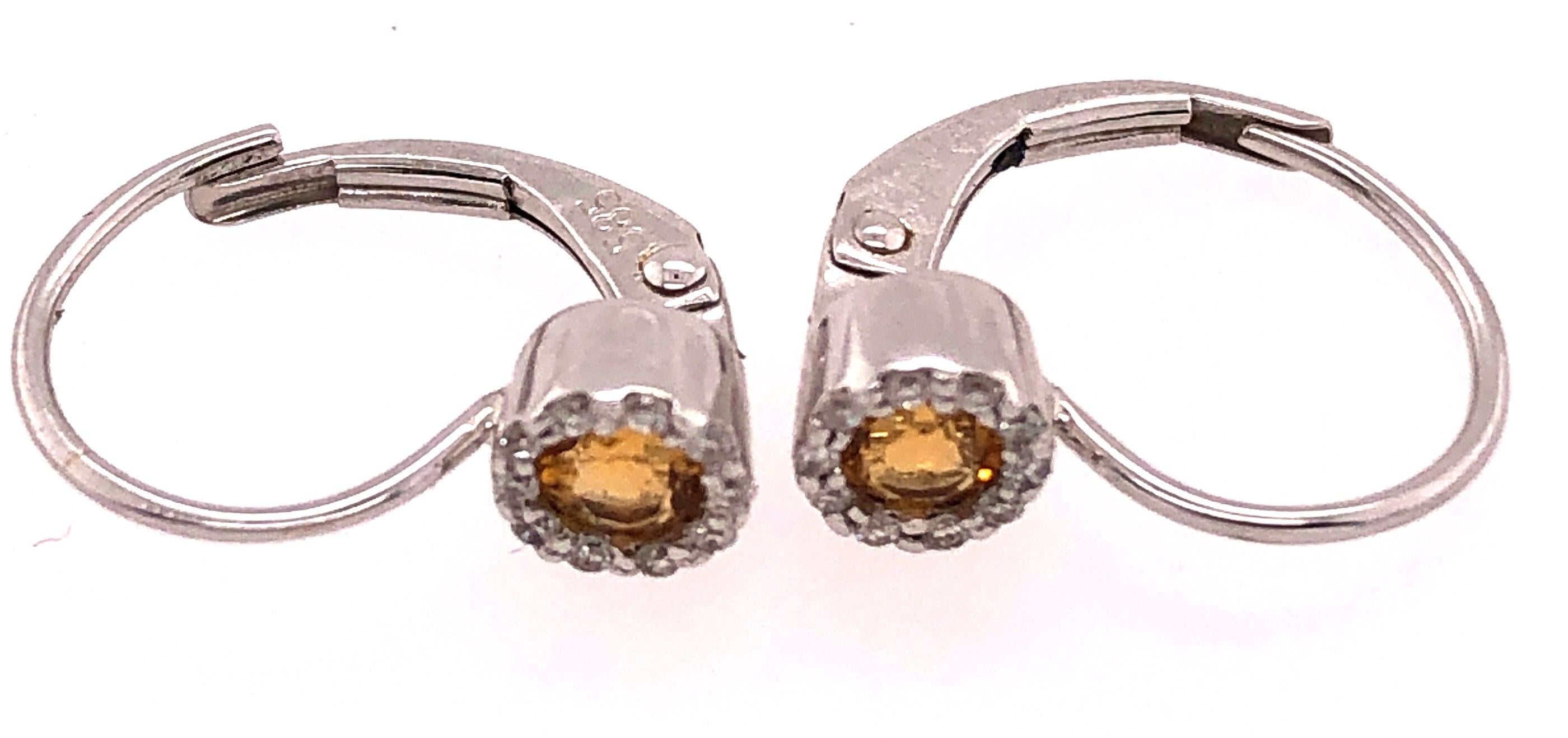 14Kt Lever Back Yellow Topaz with Diamond Earrings 1.10 grams total weight. .15 Total Diamond Weight
20 total diamonds.
