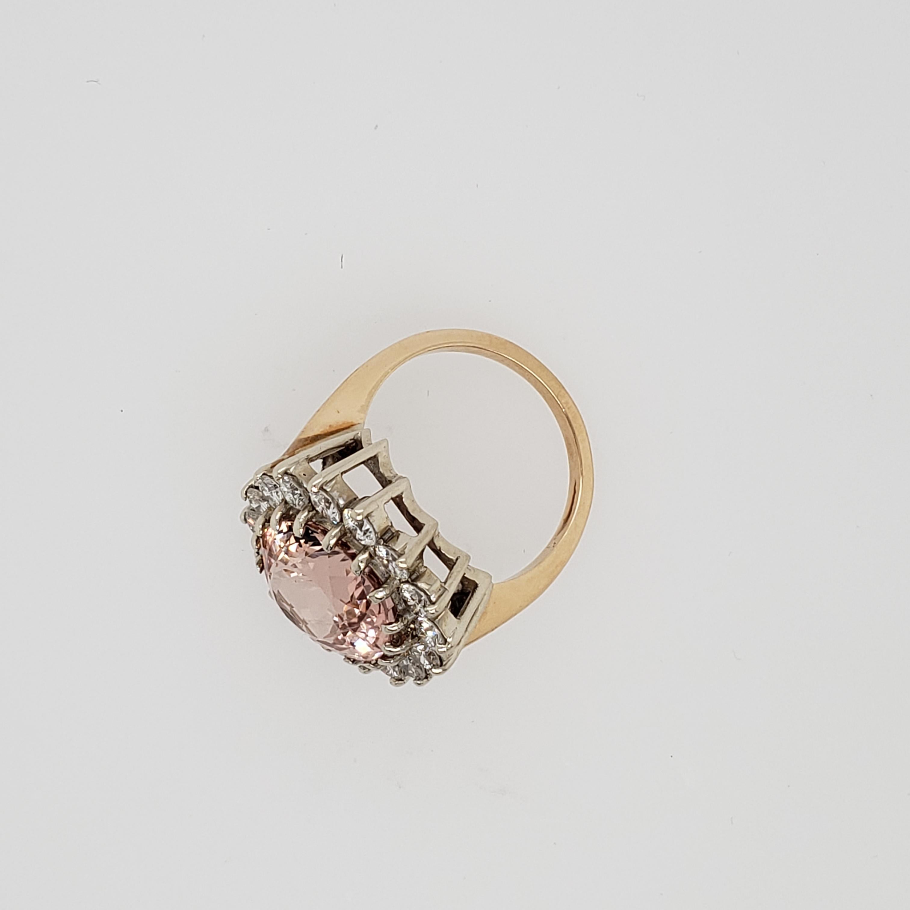 A 14 karat yellow and white gold Morganite and Diamond ring. The oval Morganite weighing 7.91 carats and accented by a halo of 16 round diamonds weighing 1.92 carats. The diamonds are G-H in color and SI in clarity. 

Size 6 and 3/4
14 Karat yellow