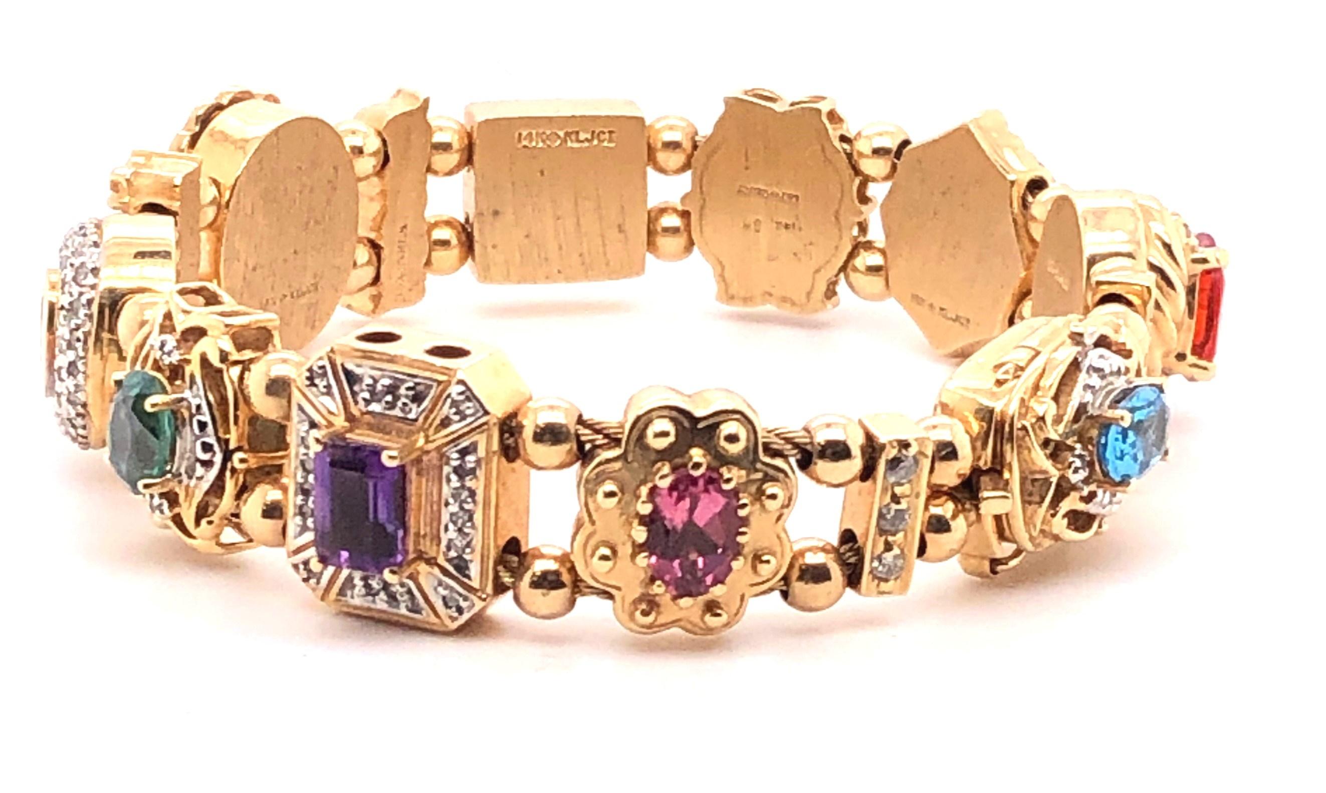14kt yellow gold slide bracelet with approximately 1.11tcw H-I color/I1-I2 clarity diamonds.  The bracelet measures 8.50 inches long with a box clasp with a safety catch. The gemstones in the bracelet are:
.80ct Blue Topaz
1.02 Citrine
1.20 Mystic