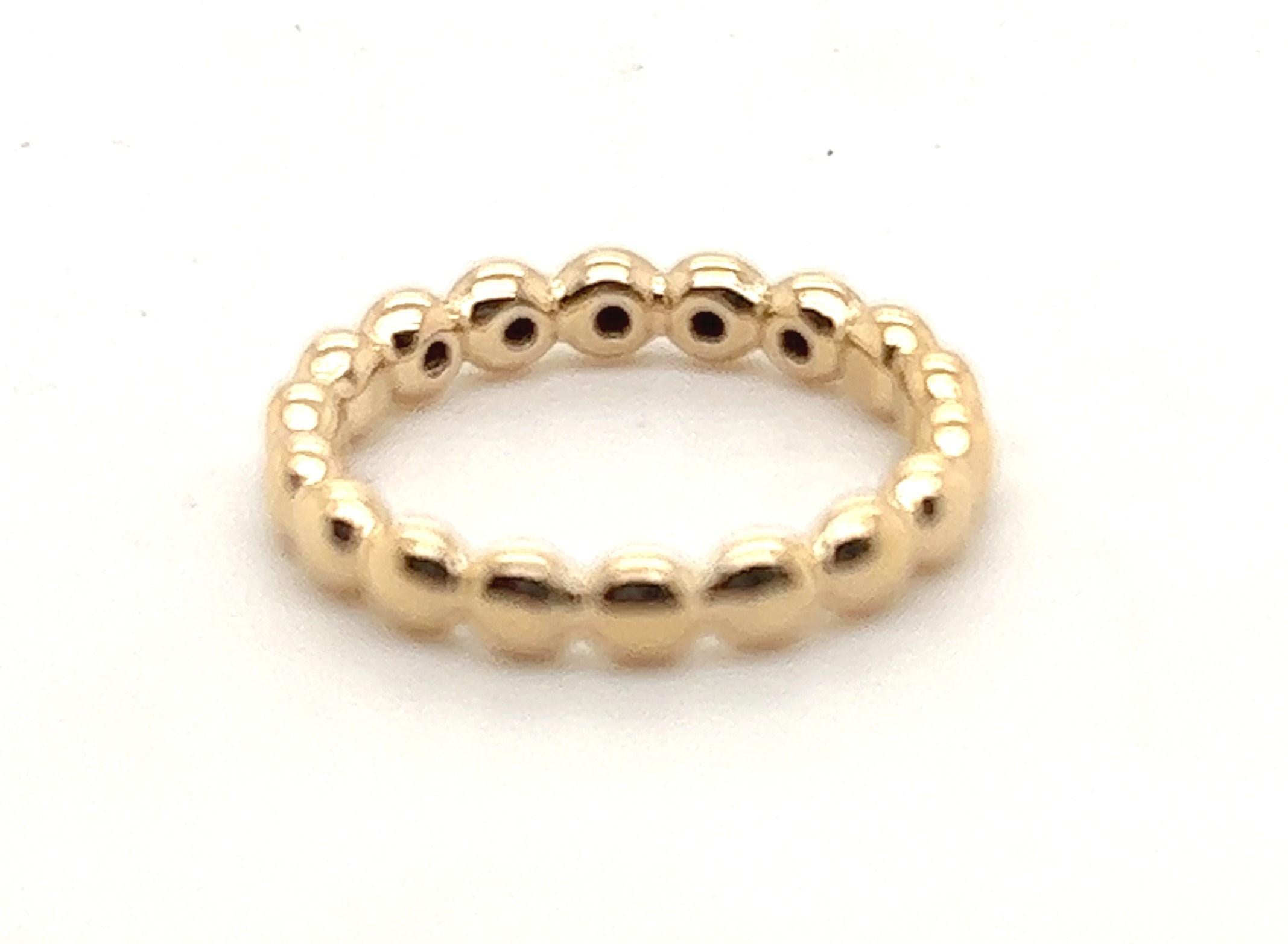 14kt yellow gold band from Pandora's Bubble line. This one contains their five Black Ice stones bezel set in the center of the ring. 

The ring measures 1/8 inch from top to bottom and is a finger size 6.

This was meant to stack with other Pandora